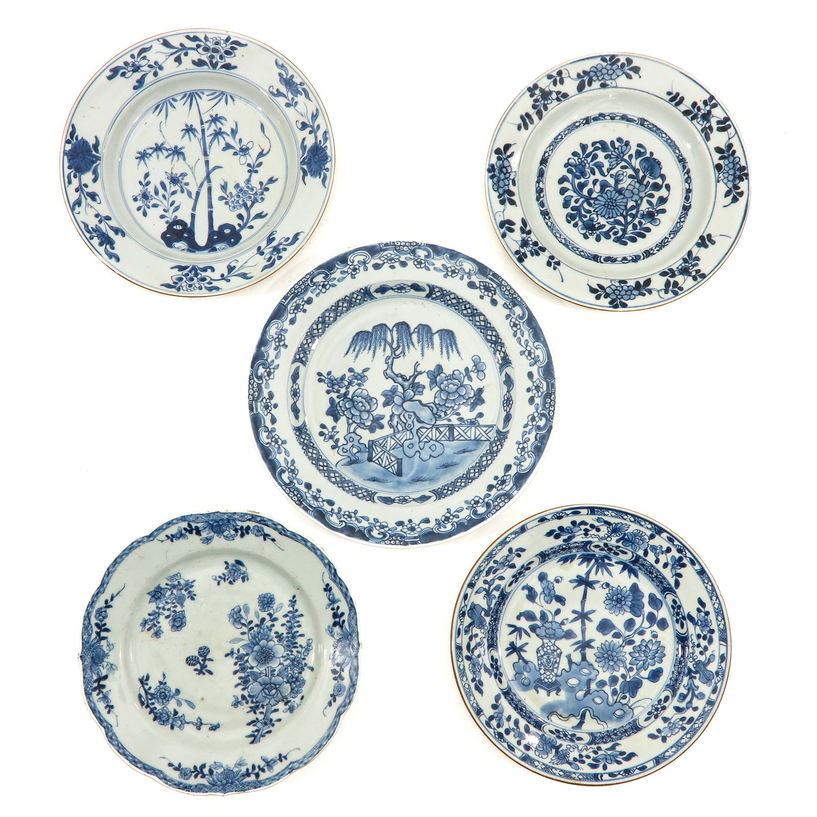 A Collection of 5 Blue and White Plates: In a variety of decors, including 18th Century, largest plate is 26 cm. in diameter, chip and hairline.