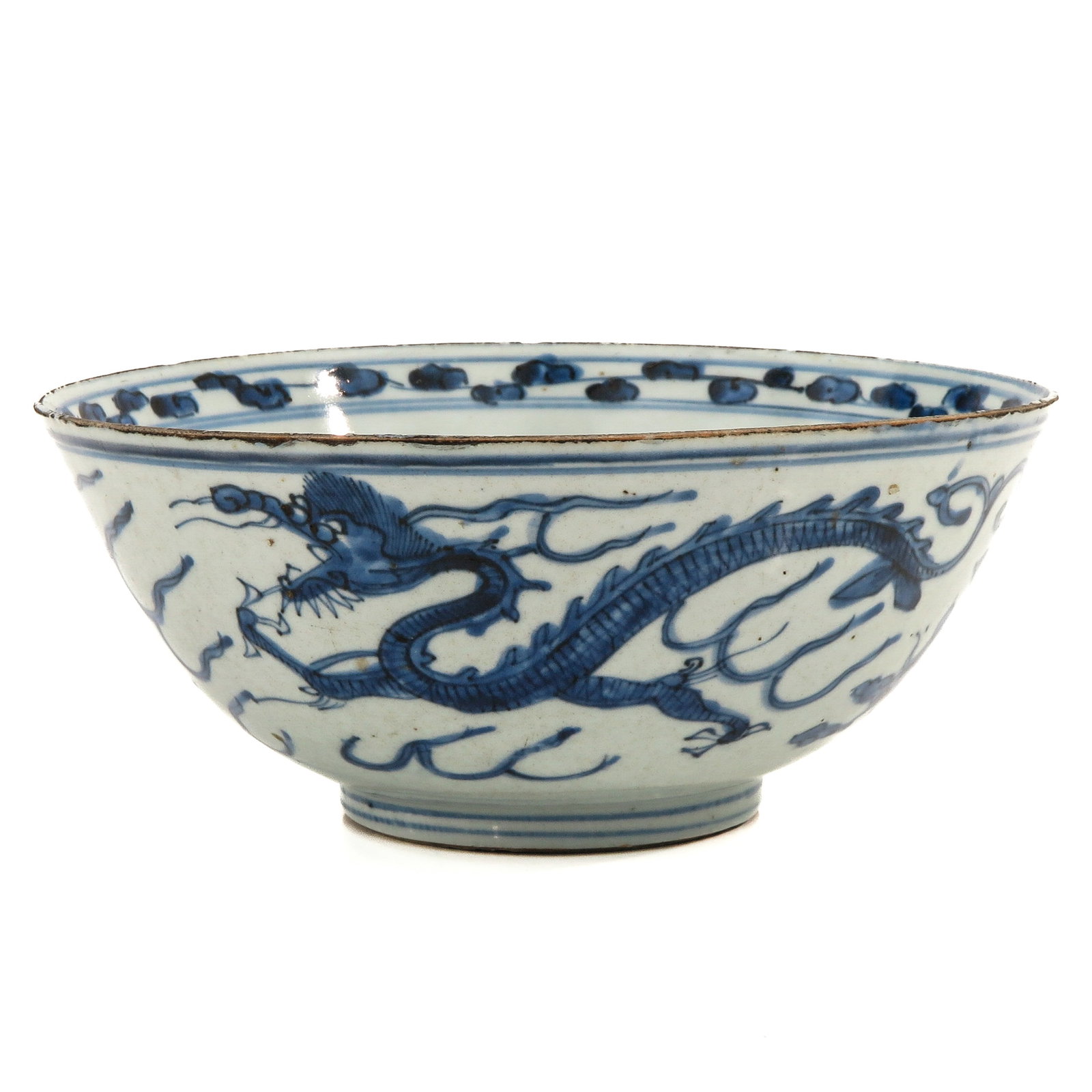 A Blue and White Phoenix and Dragon Bowl: Ming Period, 22 cm. in diameter, fritting.