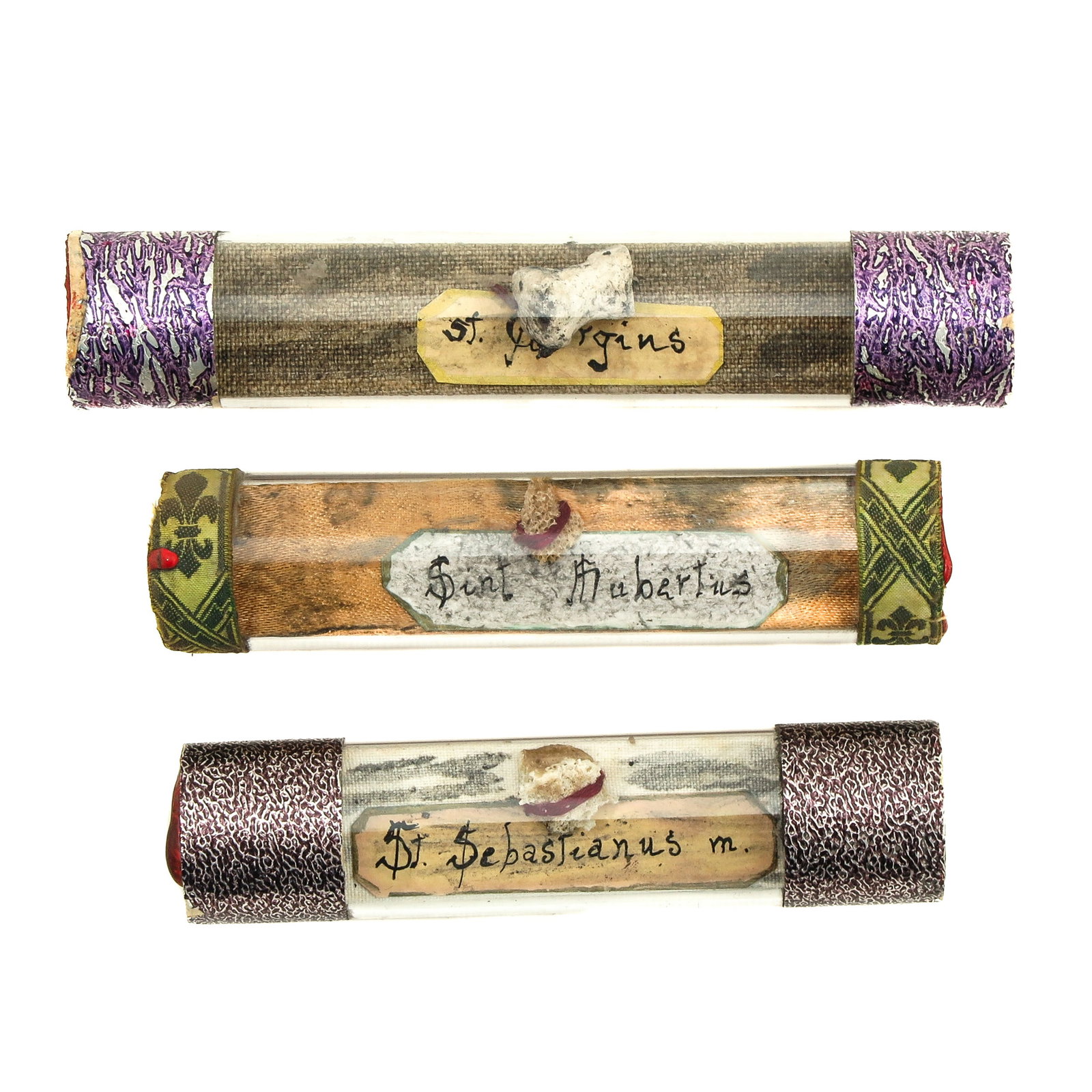 A Group of Reliquaries: consisting of 3 relics including Saint Georgins, Hubertis, and Sebastian, length 13 cm.