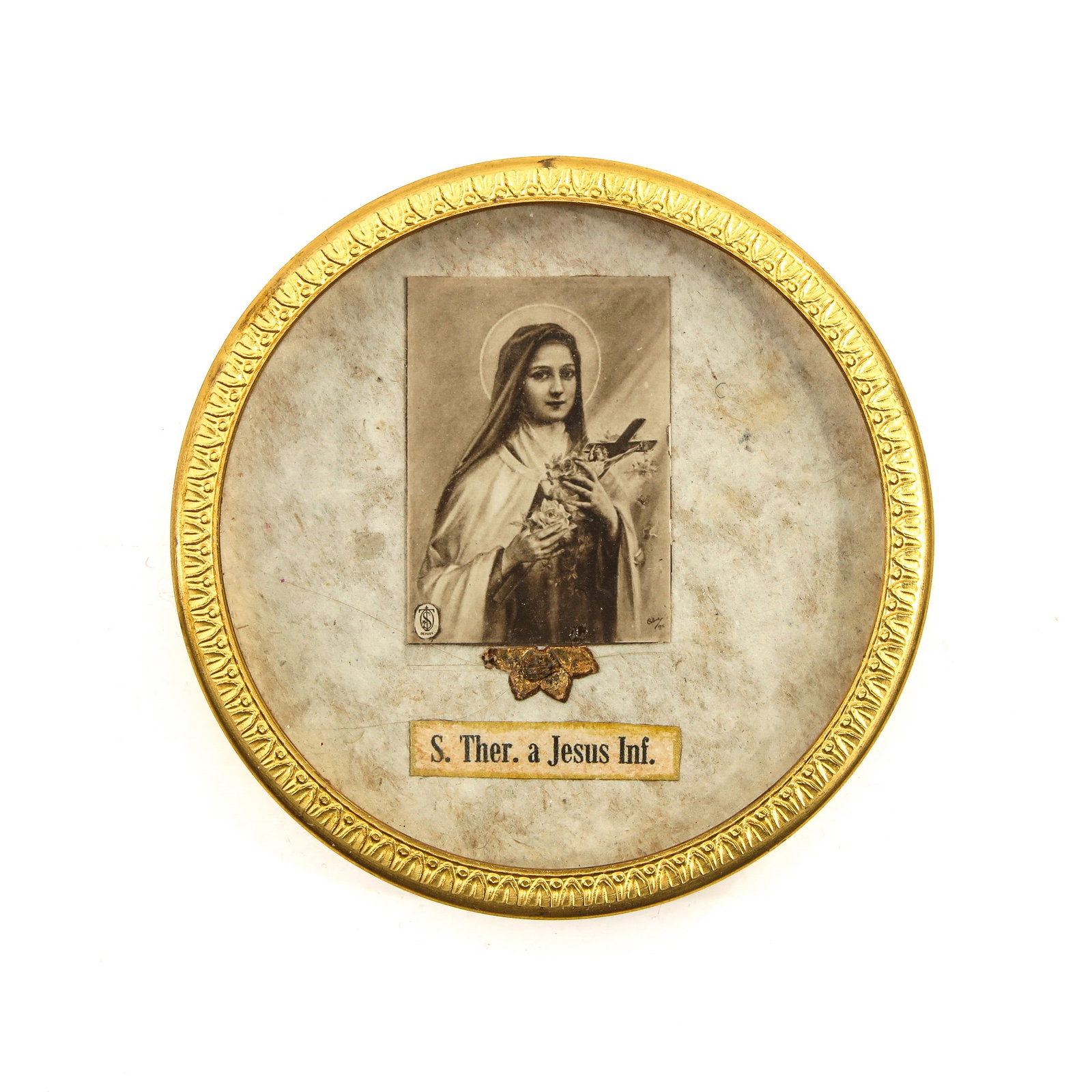 A Reliquary: containing relic of Saint Thérèse a Jesu Infante, diameter 8 cm.
