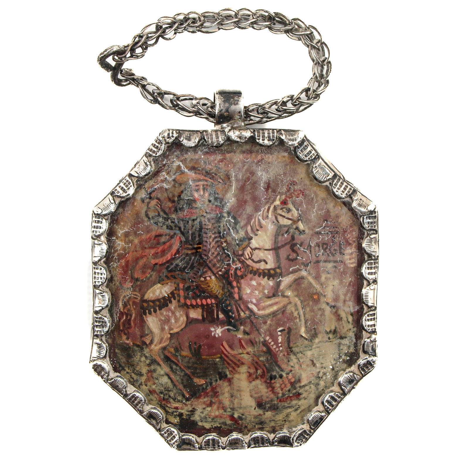 A 19th Century Silver Pendant: 19th century, silver, depicting Saint Jorge, initials IHS on the back, length 7 cm.