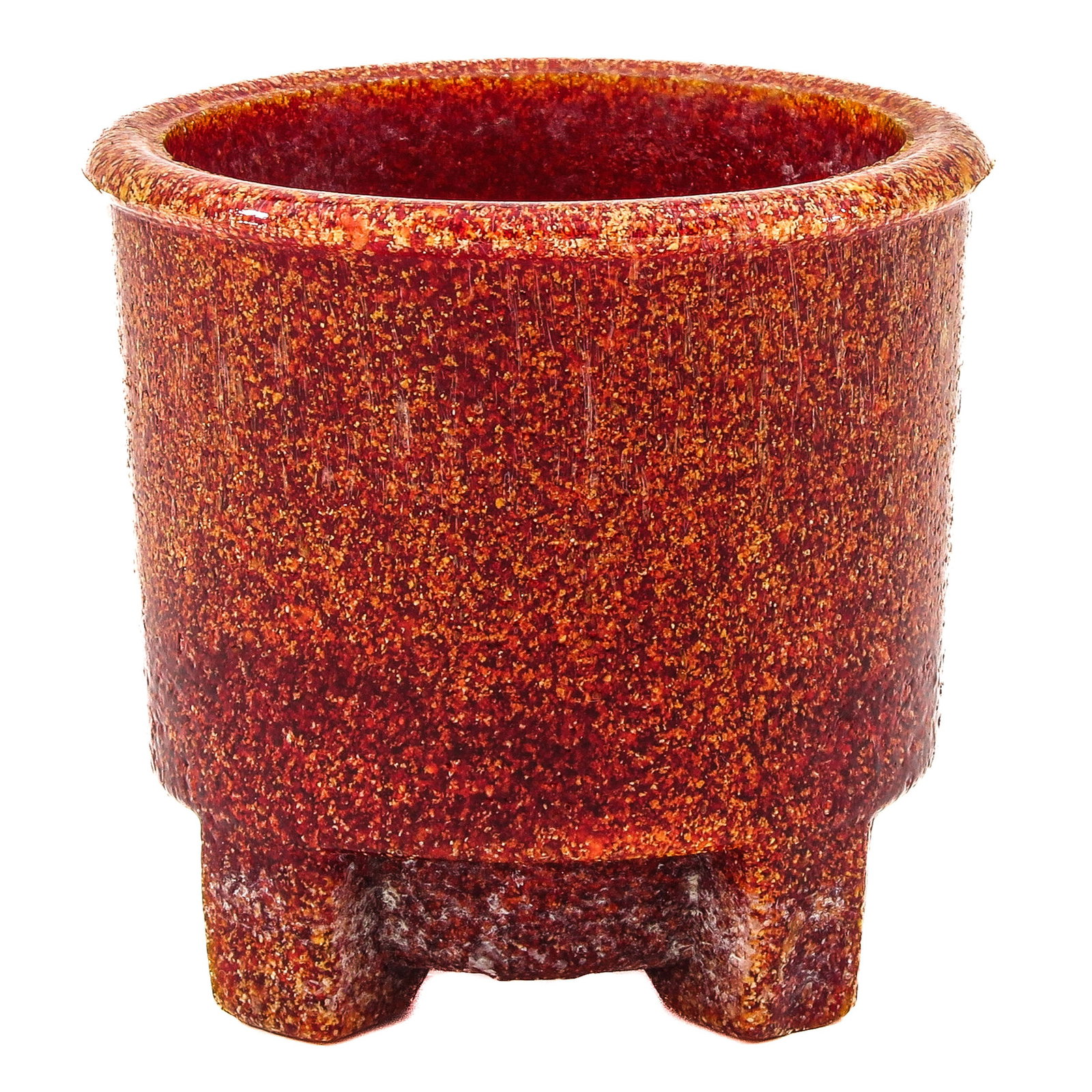 A Cactuspot: speckled red and orange. Cylindrical shape with rounded rim, resting on three integrated feet, height 6 cm.