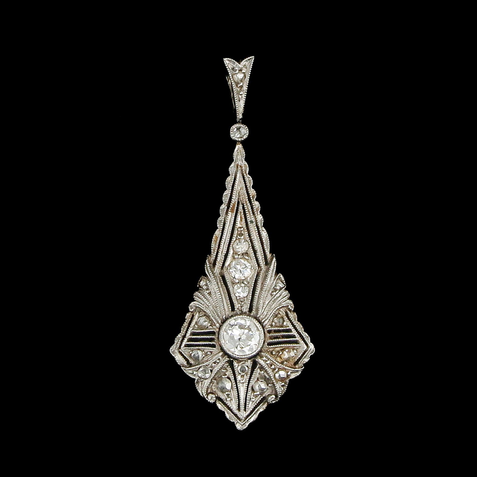 An Art Deco Diamond Pendant: Art Deco, with refined filigree work set with diamonds, length 37 mm.