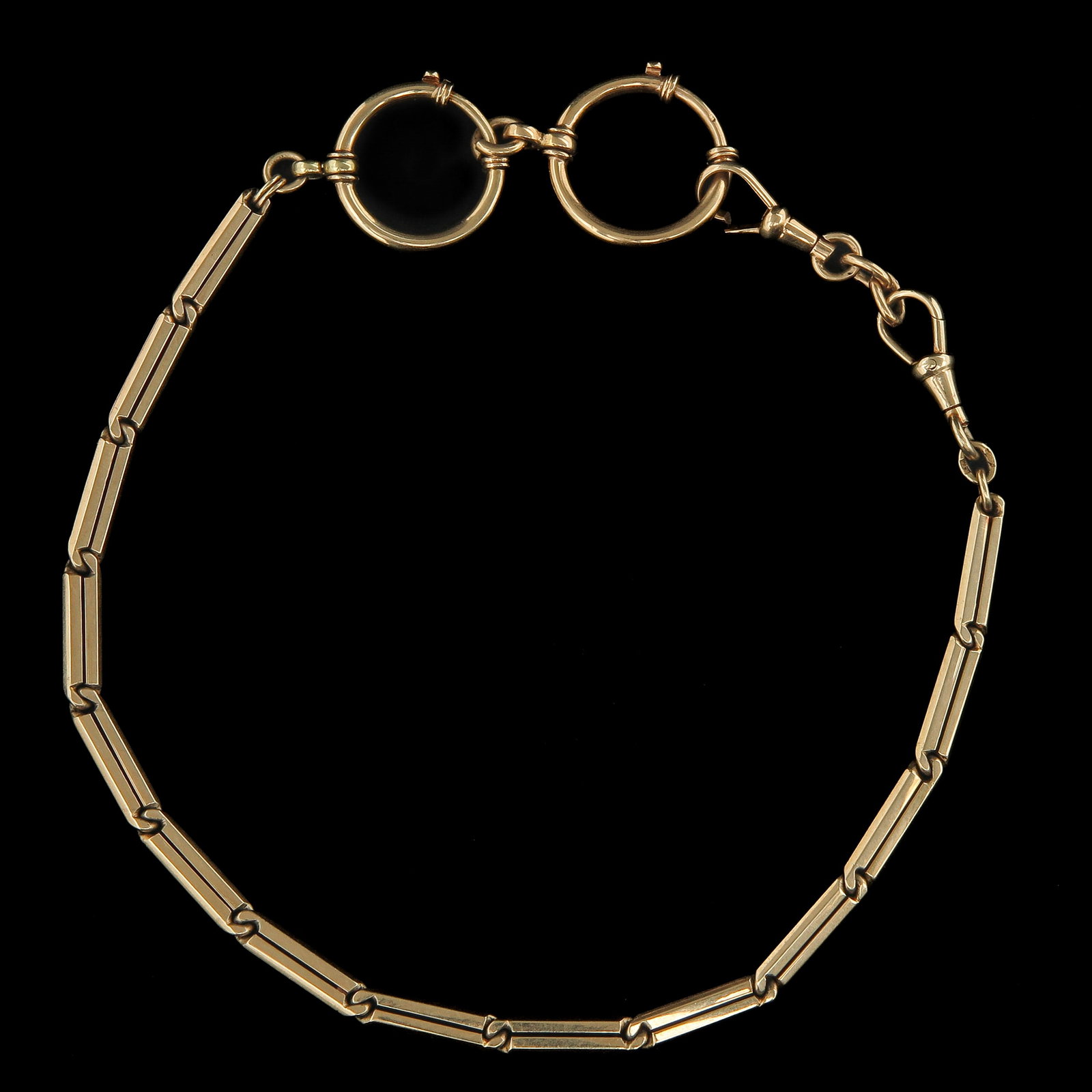A 14KG Watch Chain: with elongated bar links and two jump rings, ending in a classic twist lock, length 31 cm.