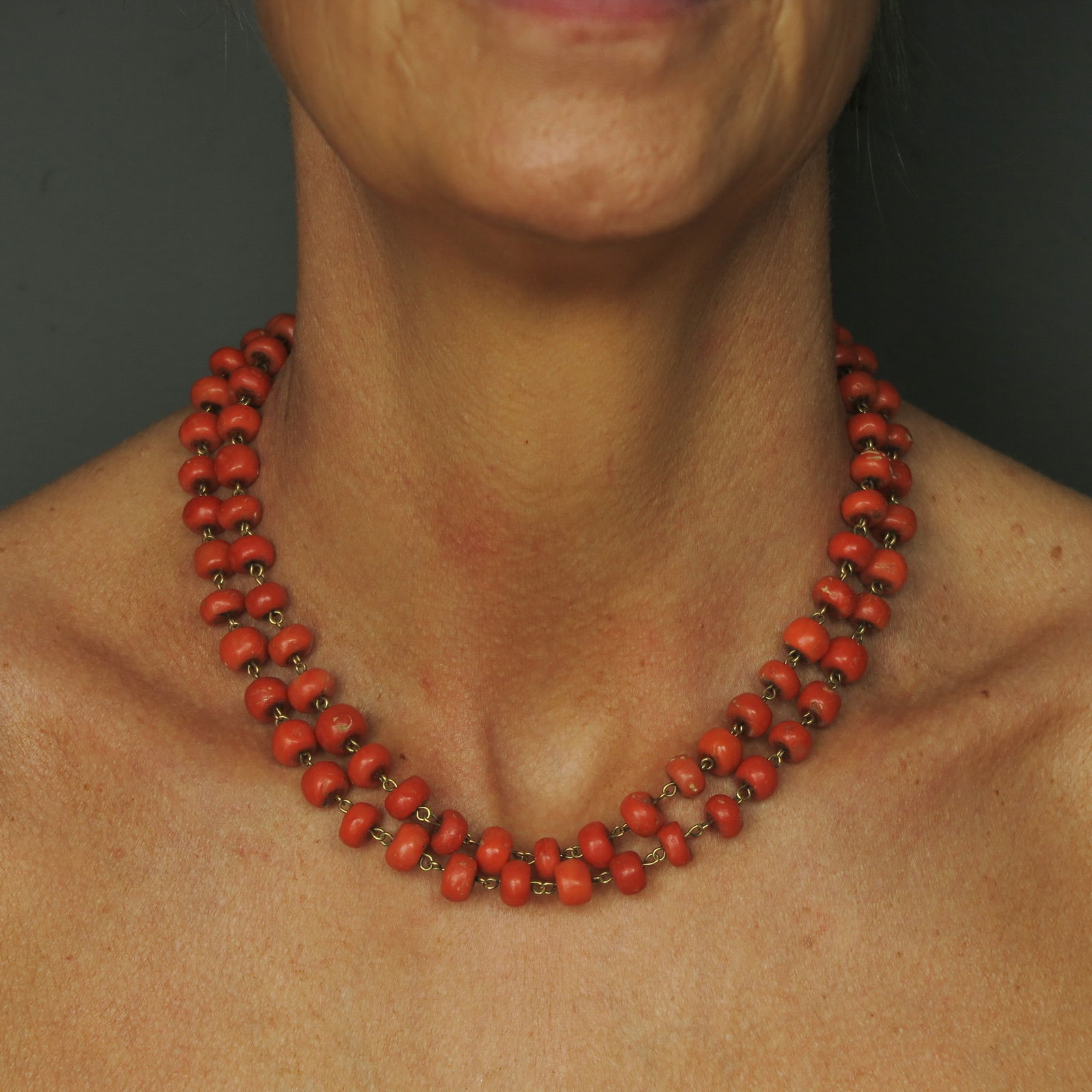 A 19th Century Red Coral Necklace: with 19th century red coral, with a 14KG clasp, diameter beads 8 - 9 mm., weight 81 grams
