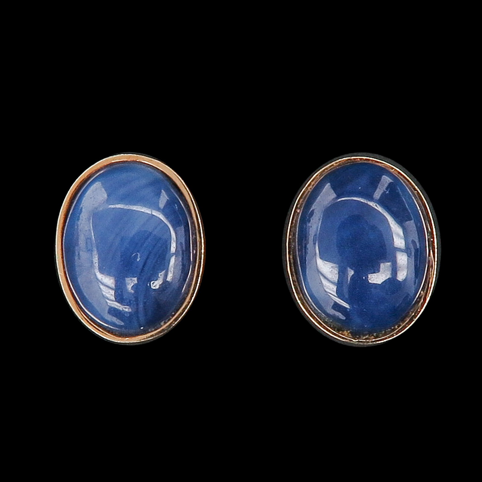 A Pair of Sapphire Earrings: 14KG, set with oval cabochon-cut sapphires, length 10 mm.