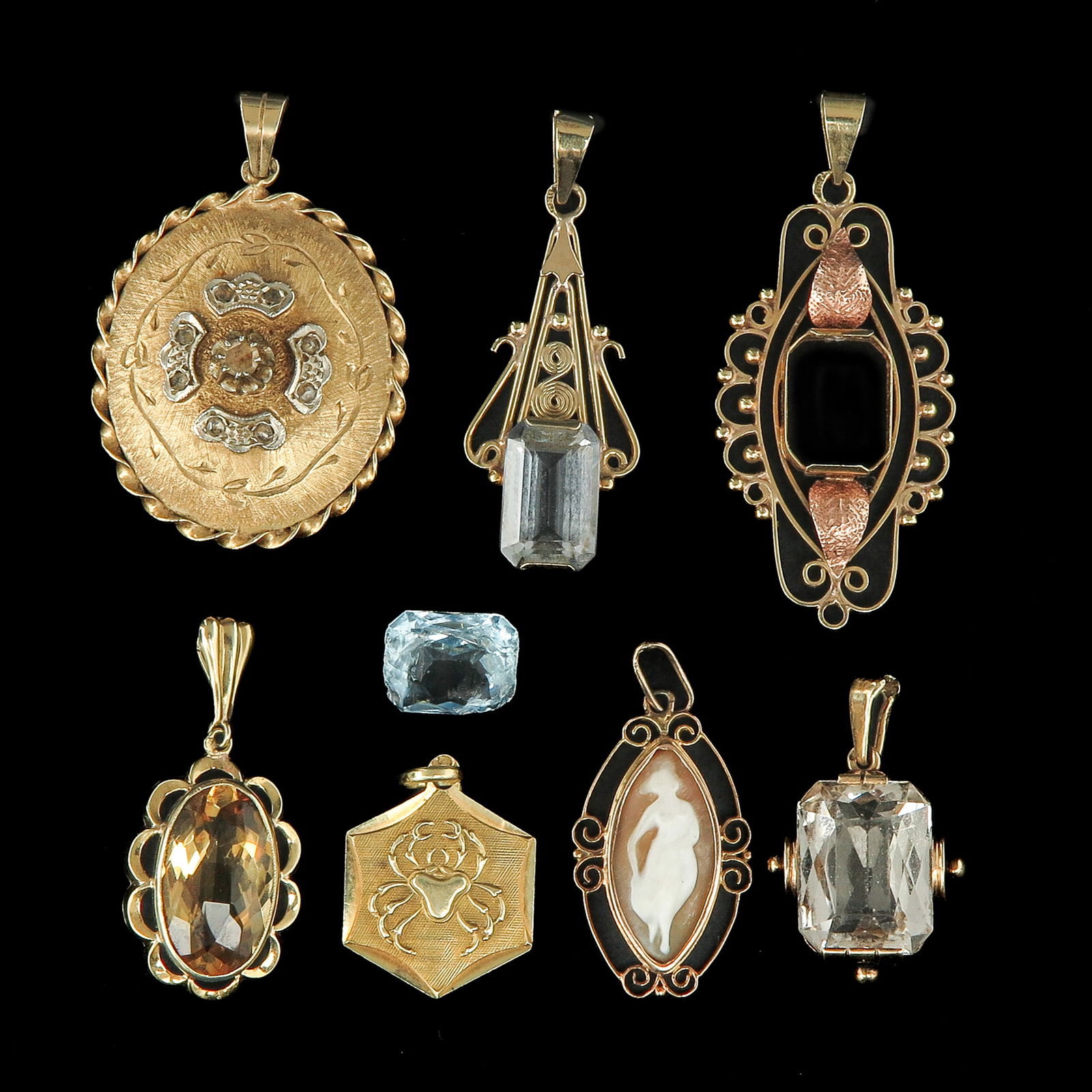 A Group of 14KG Pendants: consisting of seven pendants, with various gemstones such as topaz, longest 43 mm.