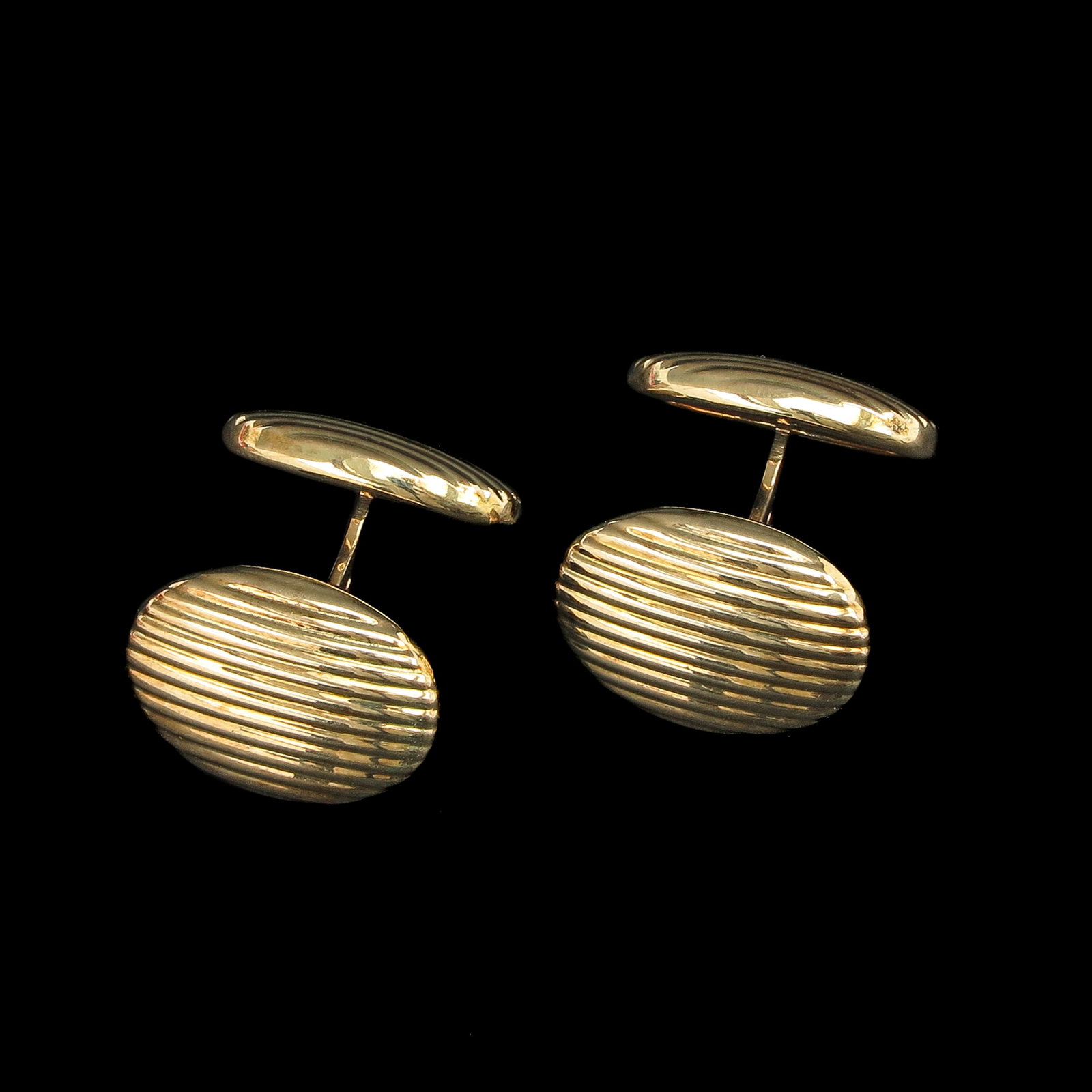 A Pair of 14KG Cufflinks: with original price tag by Fabery de Jonge