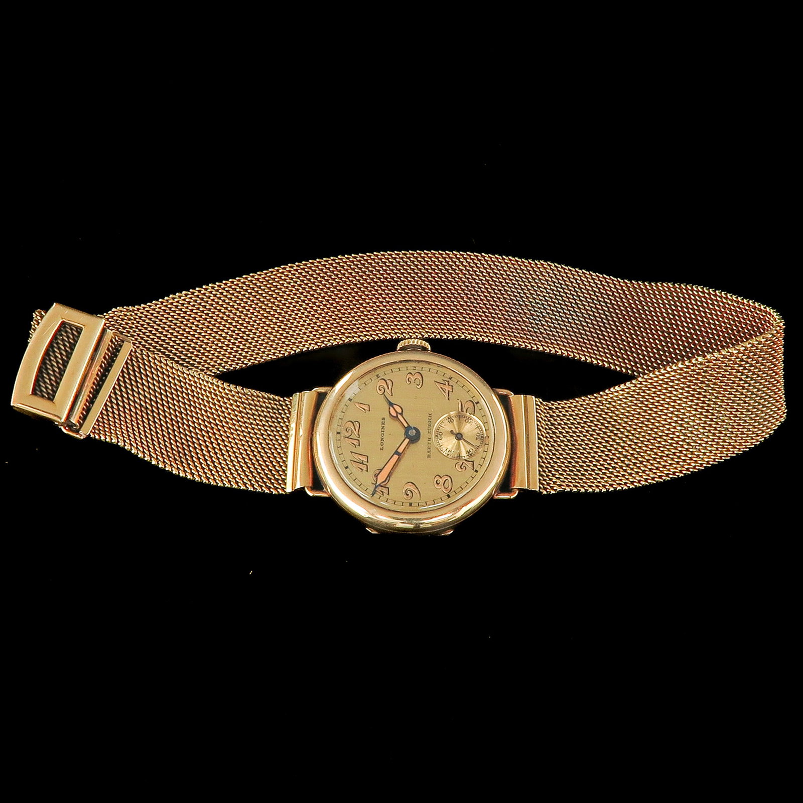 An 18KG Ladies Watch: with 18 kt gold strap, brand Longines, case diameter 27 mm.