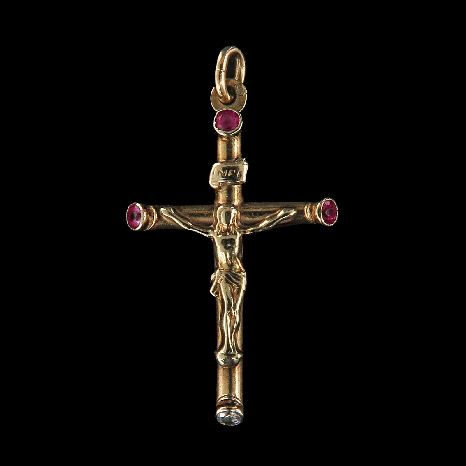 A 14KG Crucifix Pendant: set with three round rubies, INRI inscription, length 36 mm.