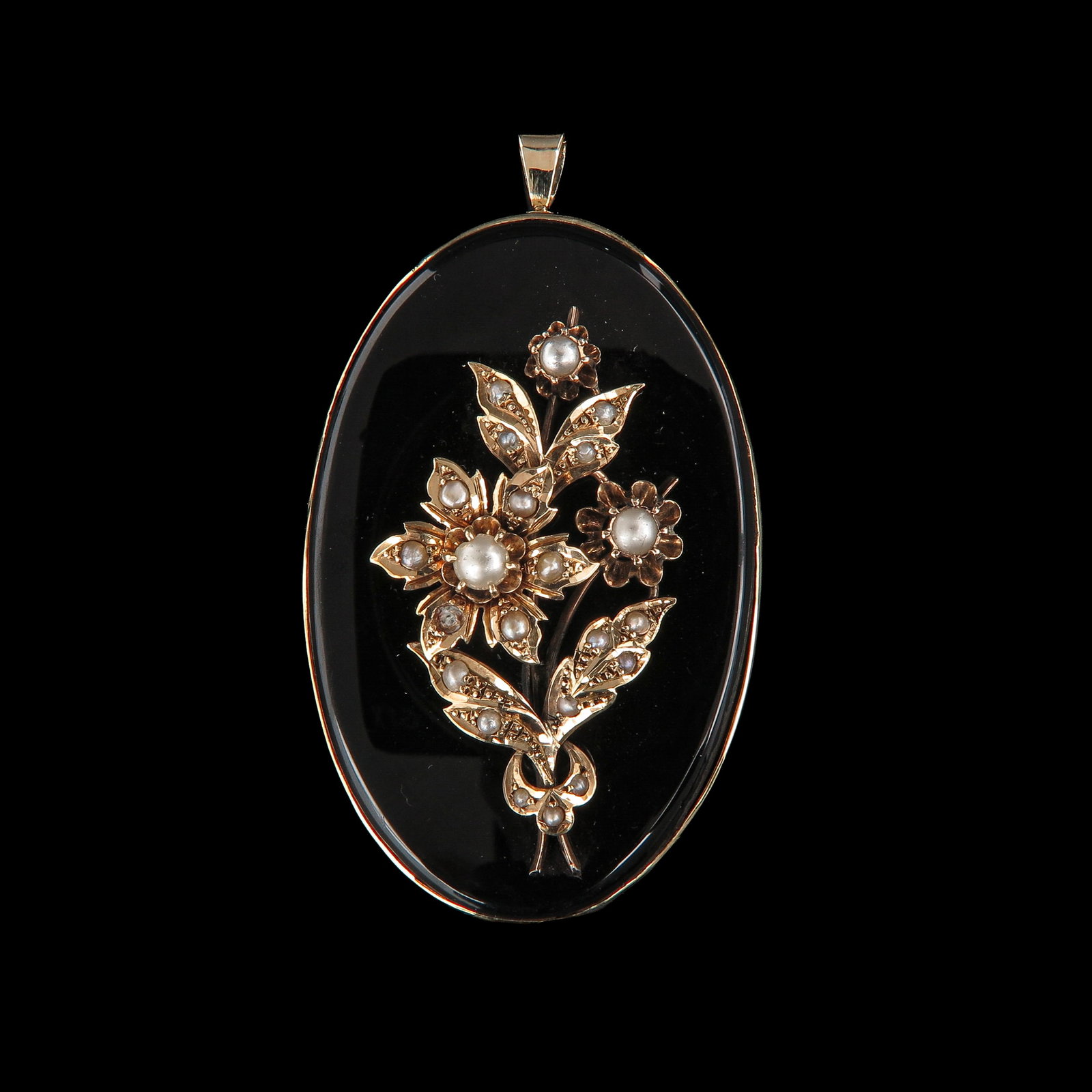 A 19th Century Pendant: 19th century, onyx set with seed pearls with a floral motif, length 60 mm. Can also be worn as a brooch