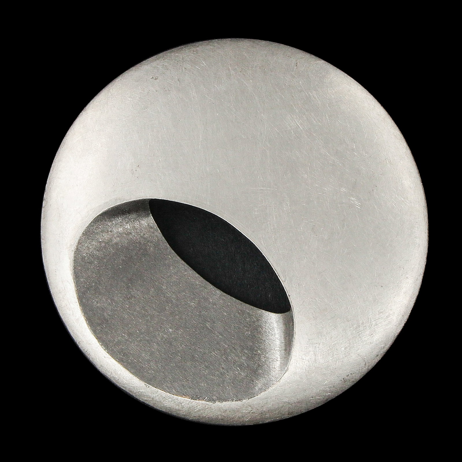 A Platinum Pendant by Claude Chavent: by French designer Claude Chavent, platinum, with a round, hollowed-out sculptural shape, diameter 45 mm.