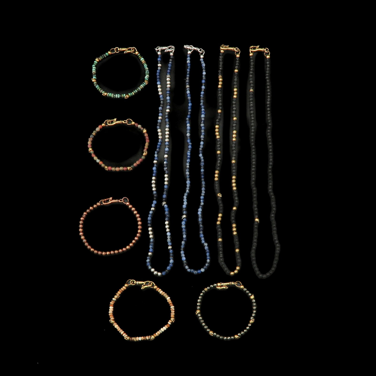 A Group of Jewelry by Designer John Varvatos: consisting of five bracelets and four necklaces by the American designer John Varvatos, made with stone beads and partly with silver clasps, longest 60 cm., retail value € 1,900