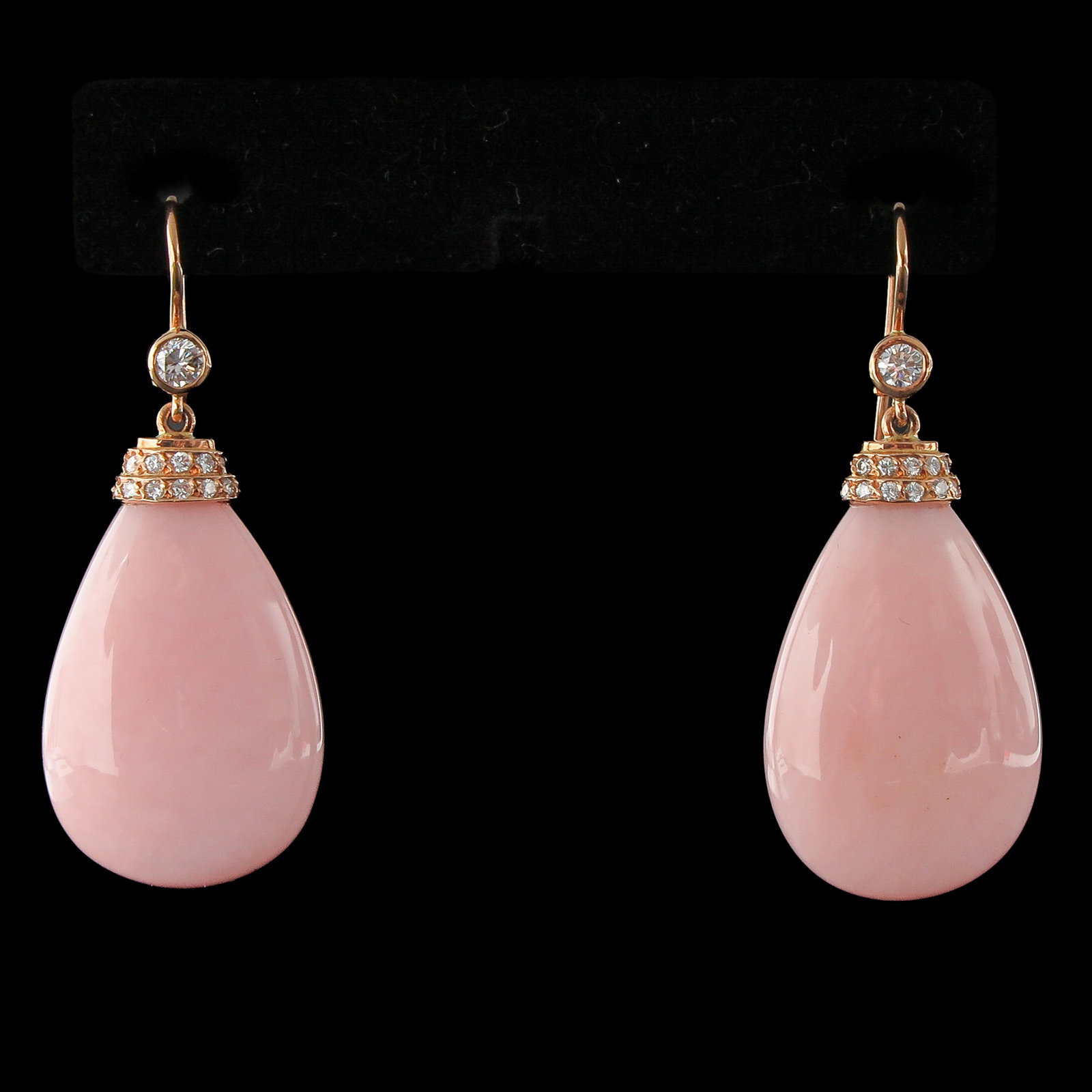 A Pair of 18KG Pink Opal and Diamond Earrings: earrings, 18KG, set with diamonds and pink opal, length 47 mm., retail value € 3,250