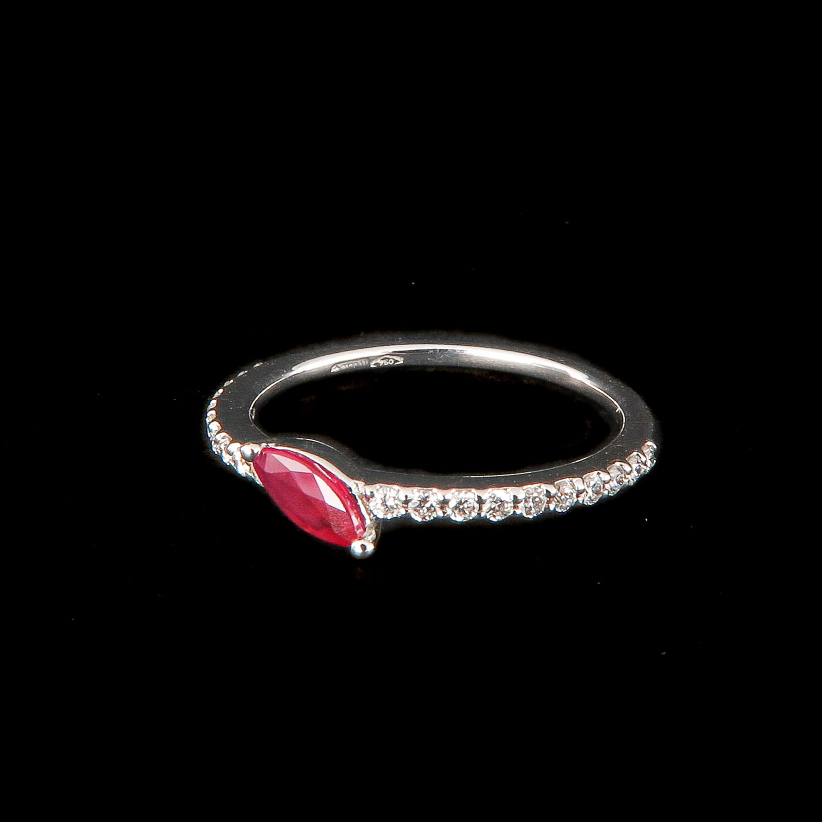 An 18KG Diamond and Ruby Ring by Designer Crivelli: by Italian designer Crivelli, set with brilliant cut diamonds, total 0.20 carat, and ruby, 0.29 carat, ring size 17, retail value €2,300