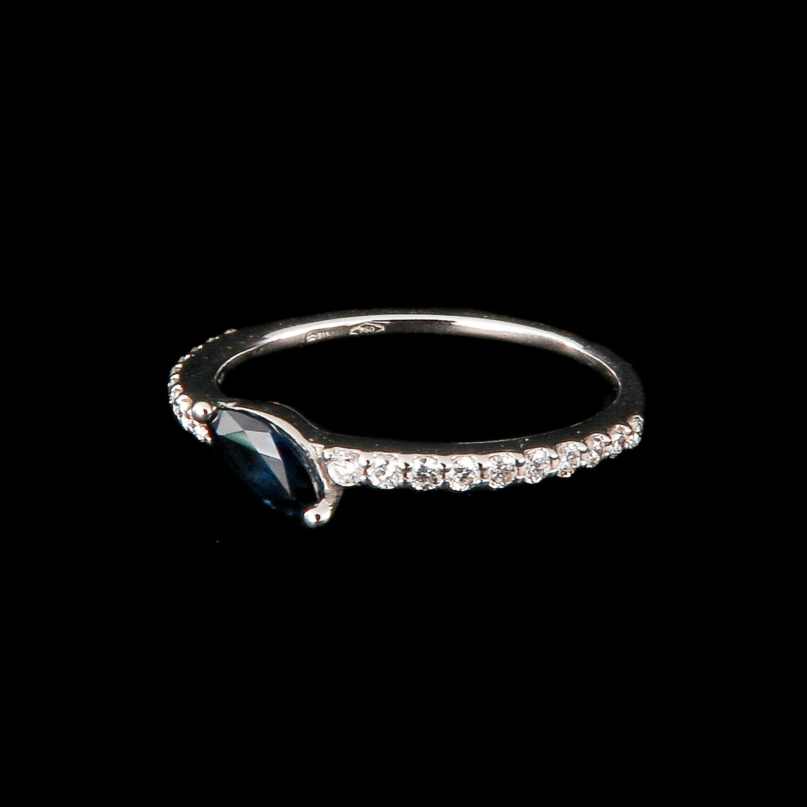 An 18KG Sapphire and Diamond Ring by Crivelli: by Italian designer Crivelli, set with brilliant cut diamonds, total 0.20 ct. and blue sapphire 0.34 ct., ring size 17, retail value € 2,300