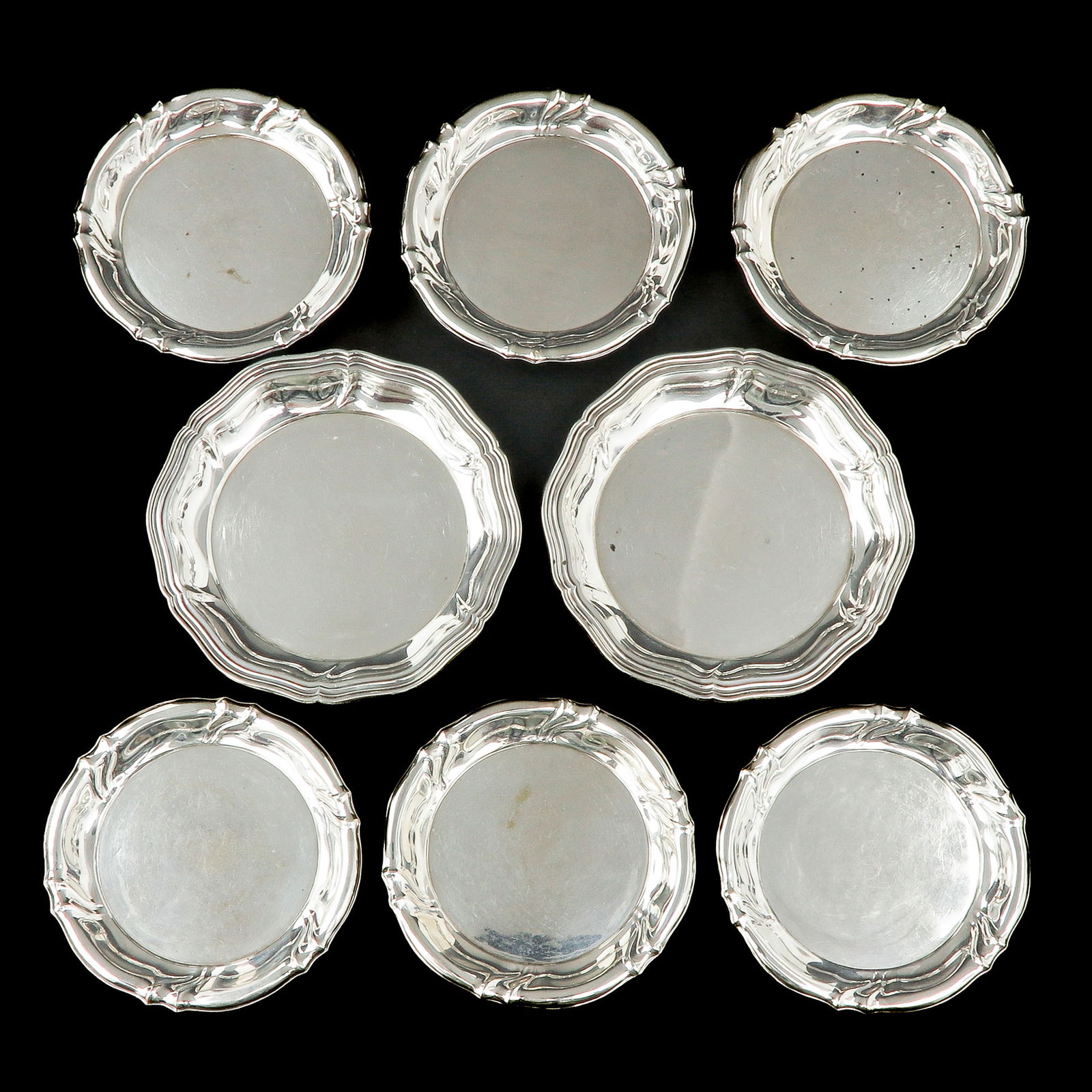A Group of Eight Silver Coasters: consisting of 8 coasters, 800 / 1000 silver, the largest has a diameter of 11 cm.