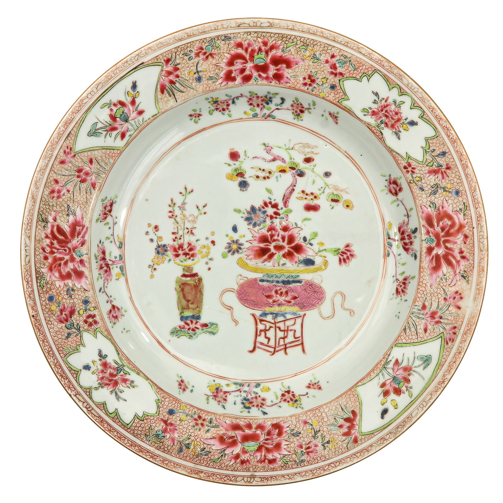 A Famille Rose Charger: Decorated with an elaborate design of flower vases and peonies. The wide border depicting cartouches and floral reserves, Yongzheng Period, 34 cm. in diameter, restored.