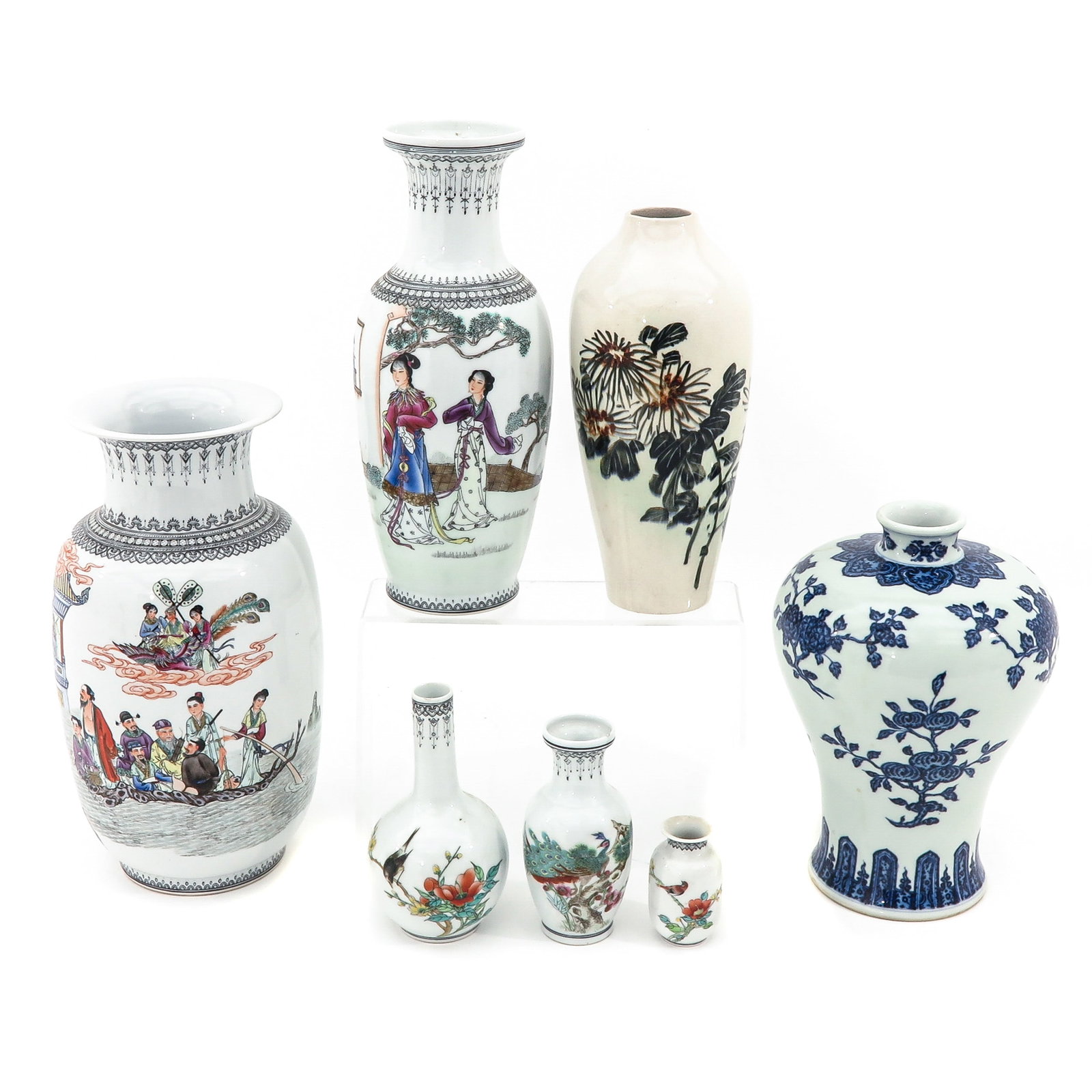 A Collection of Seven Vases: In a varied assortment of decors and sizes, tallest vase is 34 cm.