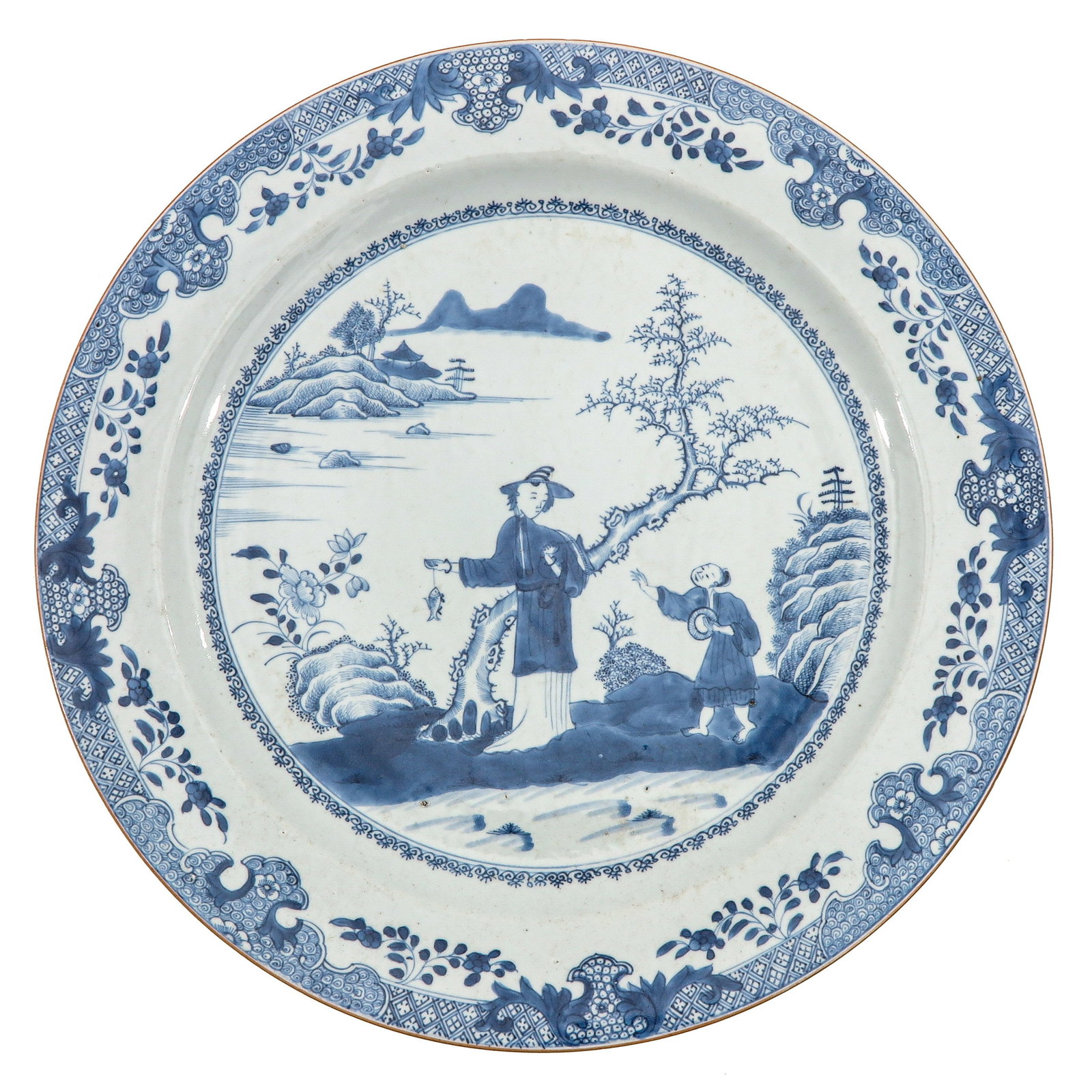 A Blue and White Charger: Depicting a landscape with Chinese figures, 18th Century, 41 cm. in diameter.