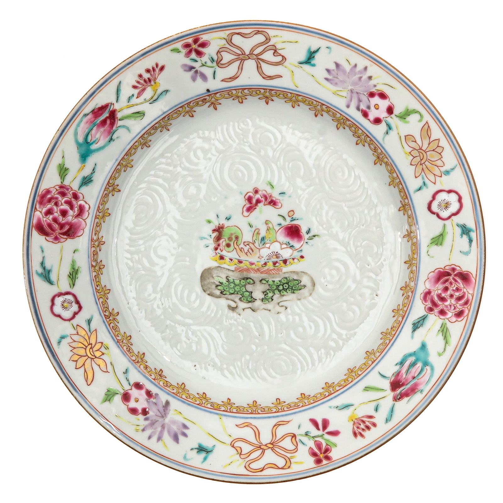 A Famille Rose Plate: Decorated with a basket of flowers in center of plate with a border depicting flowers and gilt bows, 18th Century, 23 cm. in diameter.