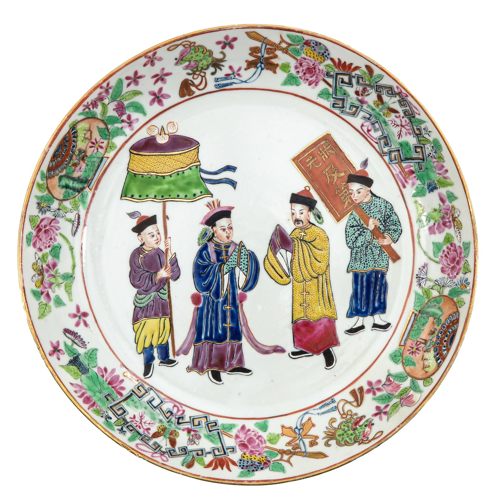 A Famille Rose Plate: Depicting a procession of dignitaries in the center, within a border of flowers and butterflies, 24 cm. in diameter.