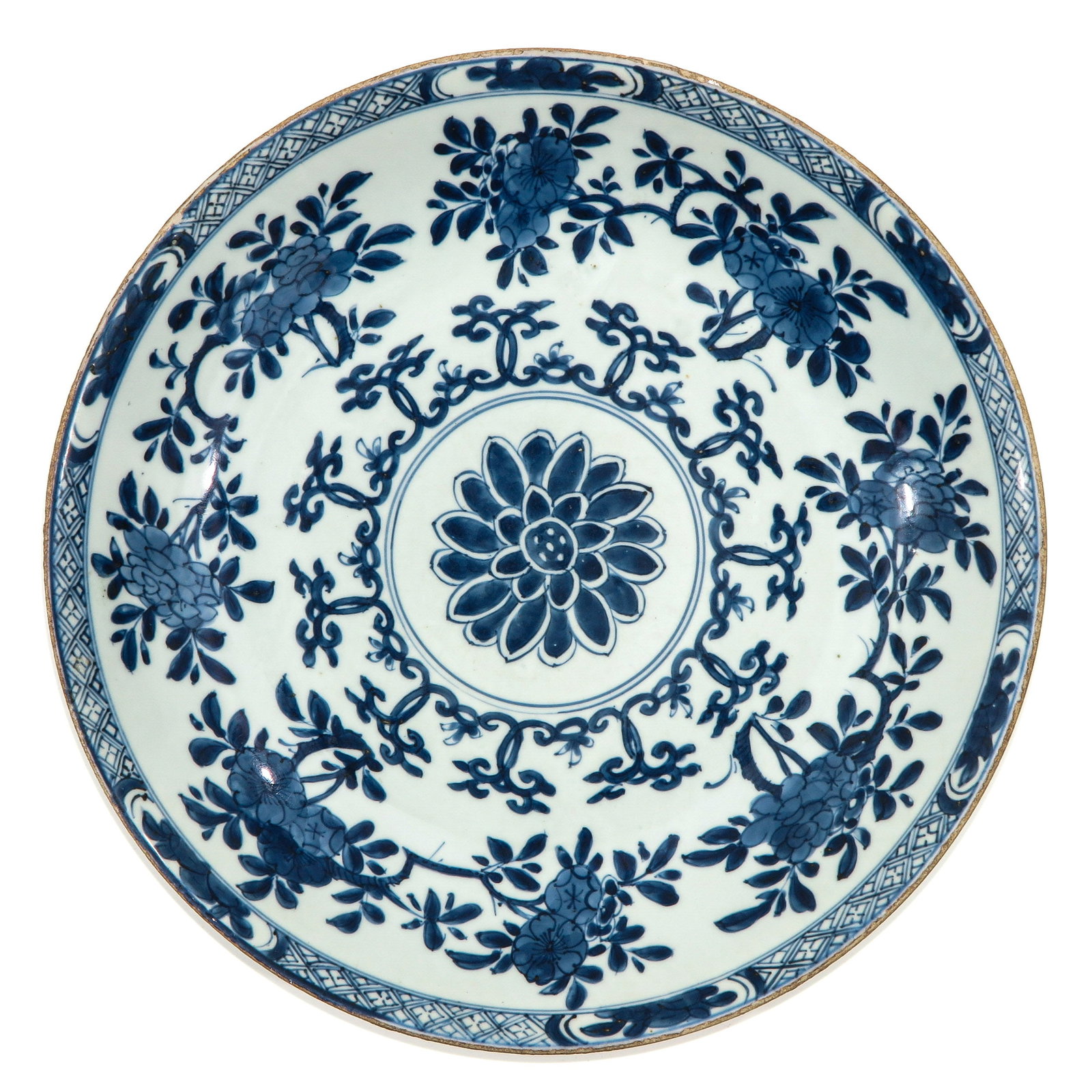A Blue and White Charger: Floral Decor, 18th Century, 39 cm. in diameter, fritting.