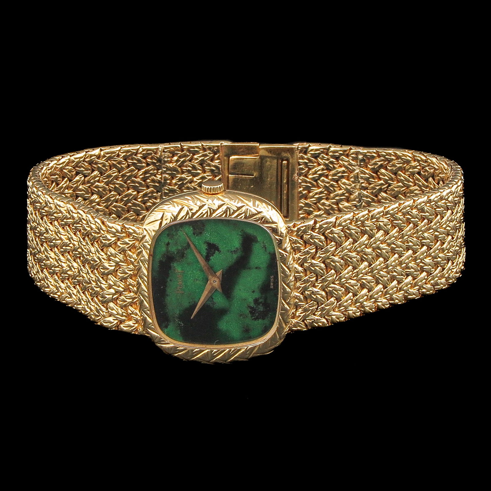 A Ladies Piaget 18KG Watch: Piaget brand, 18-karat gold, with a malachite dial, including original box and certificate dated 1977.