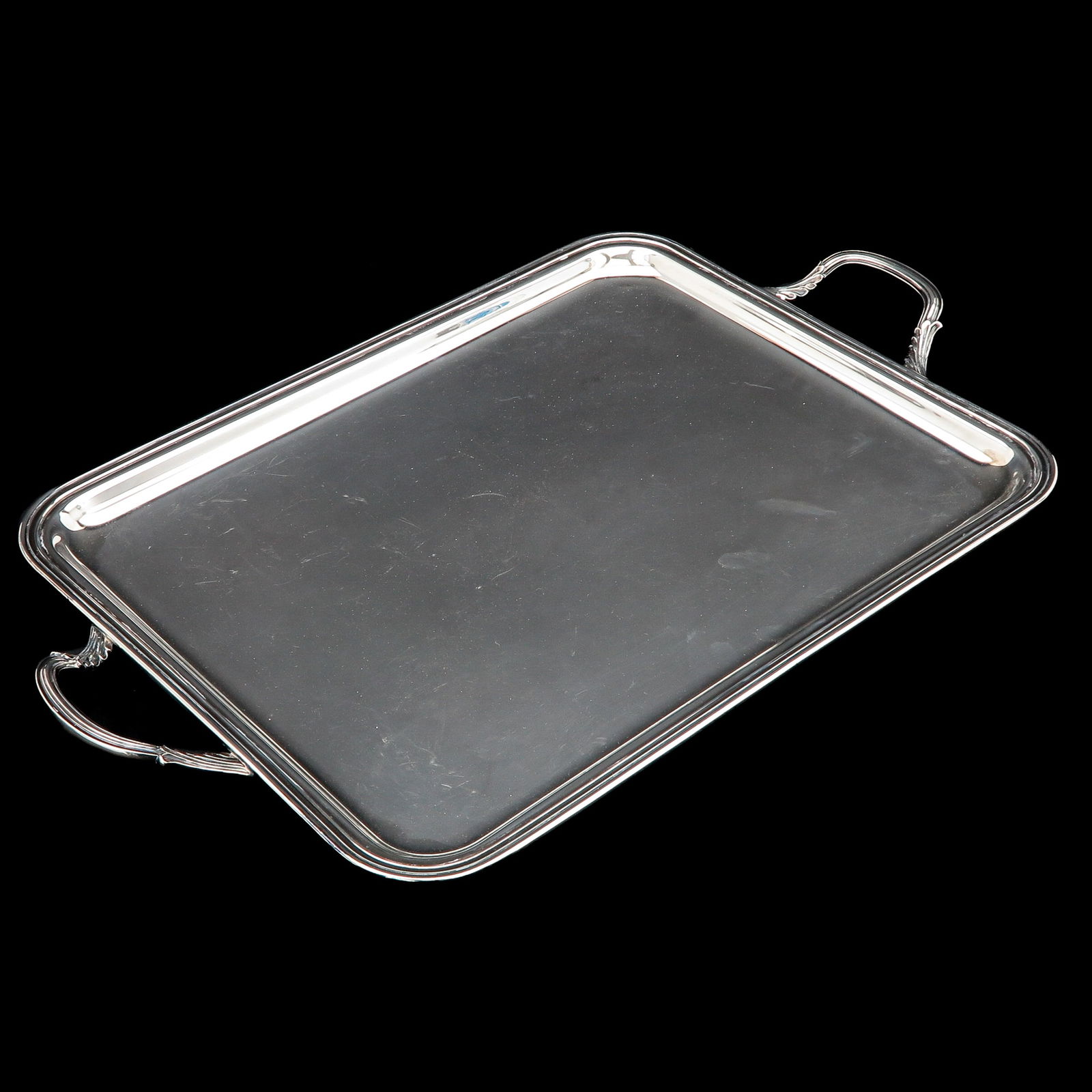 A Silver Tray: Silver, rectangular smooth model with a fillet edge, dimensions 46 x 36 cm. Excluding handles, maker's mark Simons Juwelier b.v.