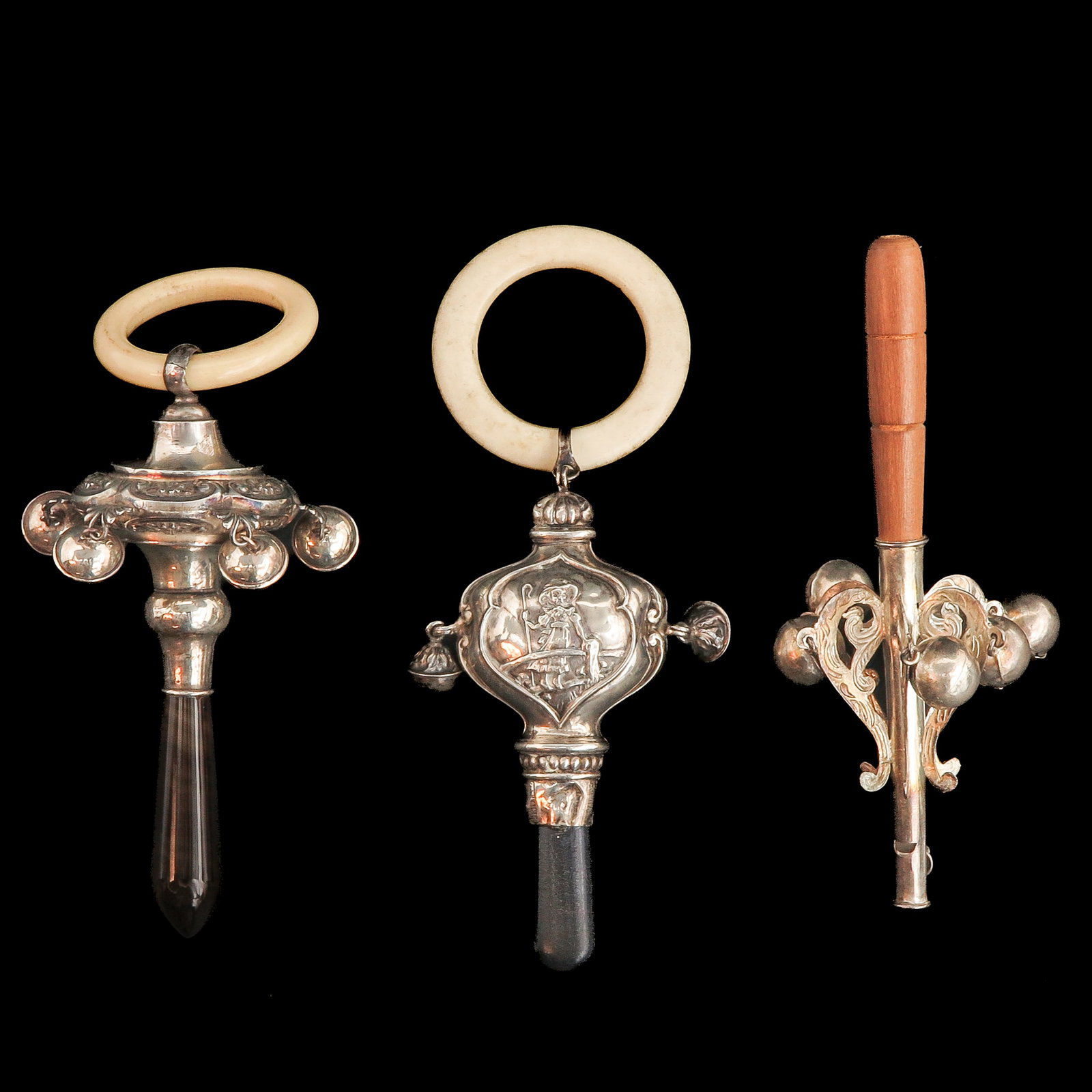 A Lot of 3 Silver Rattles: Consisting of three silver rattles, longest 16 cm.