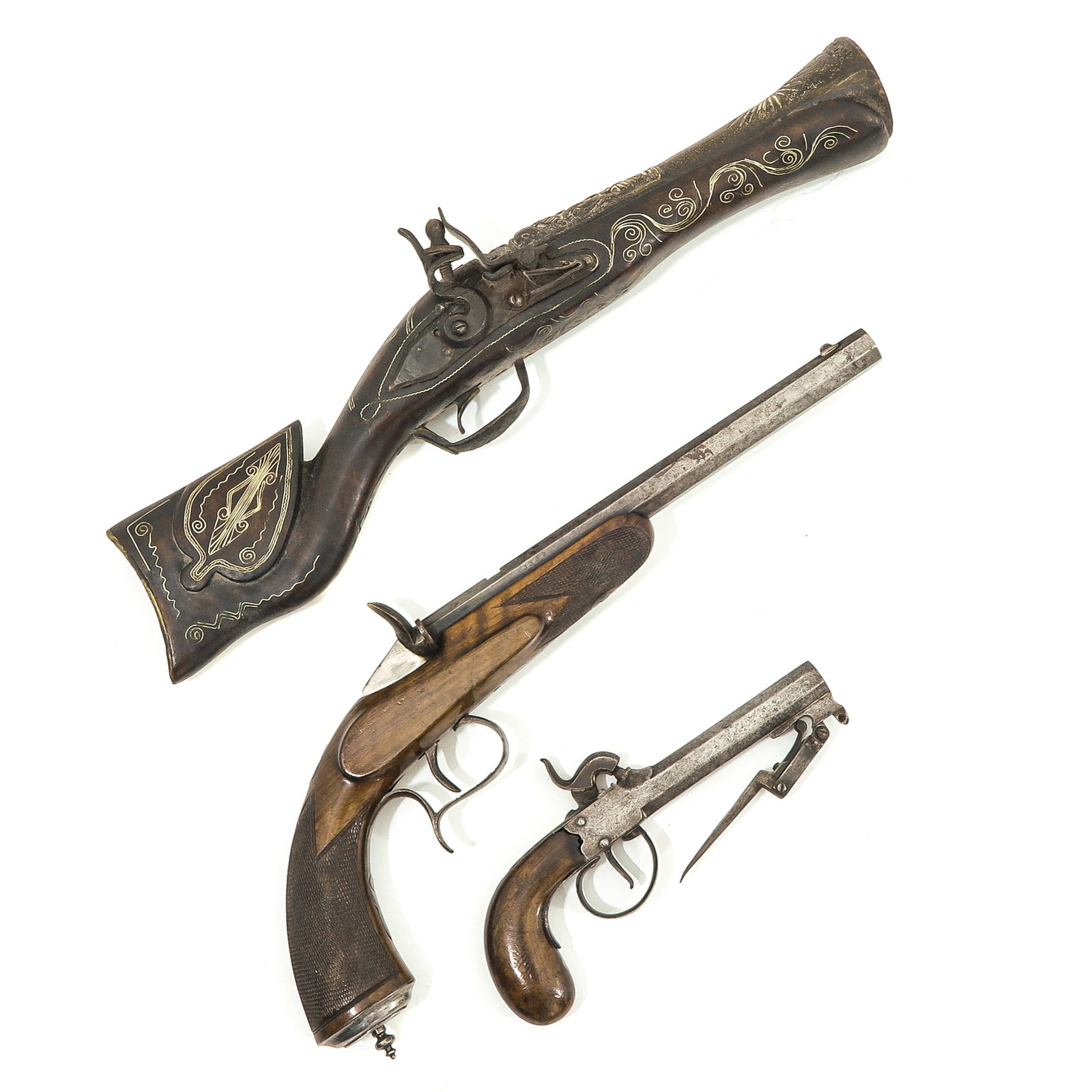 A Group of 3 Weapons: 3 weapons, including a Flobert pistol, no. 3335, circa 1920, length 40 cm. These weapons are exempt under Article 18 of the Dutch War Crimes Act (RWM).