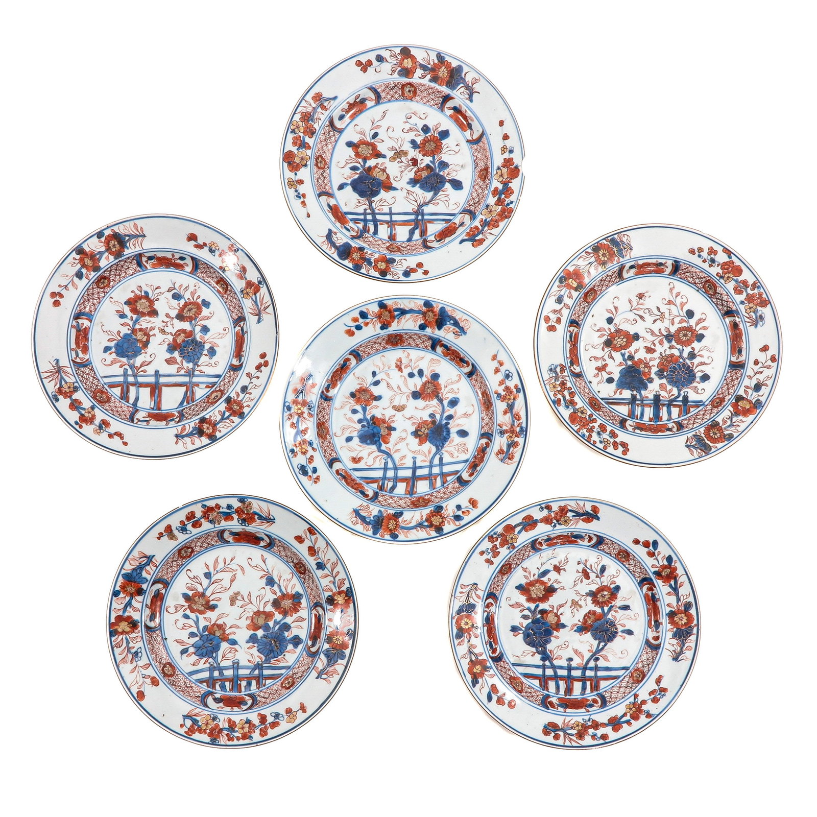 A Series of 6 Imari Plates: In traditional Imari decors of iron red, blue and gilt enamels, 18th Century, 23 cm. in diameter, chip and hairline.