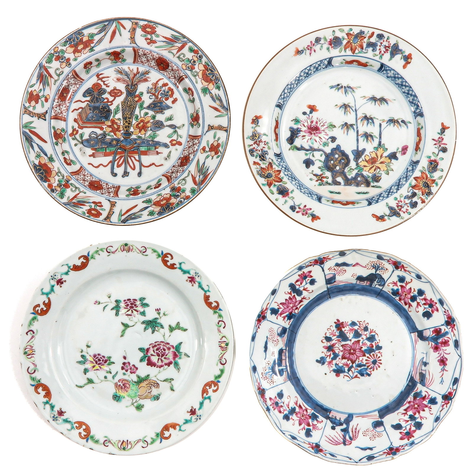 A Collection of Four Plates: In a variety of decors, 18th Century, 23 cm. in diameter, chip and hairline.
