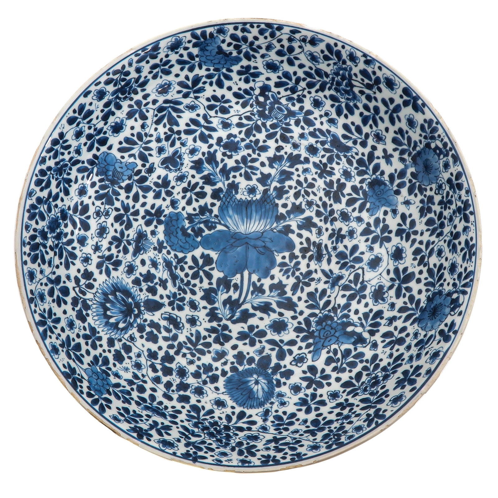 A Blue and White Charger: Full floral decor, marked with double ring and artemisia leaf, 39 cm. in diameter, chip.