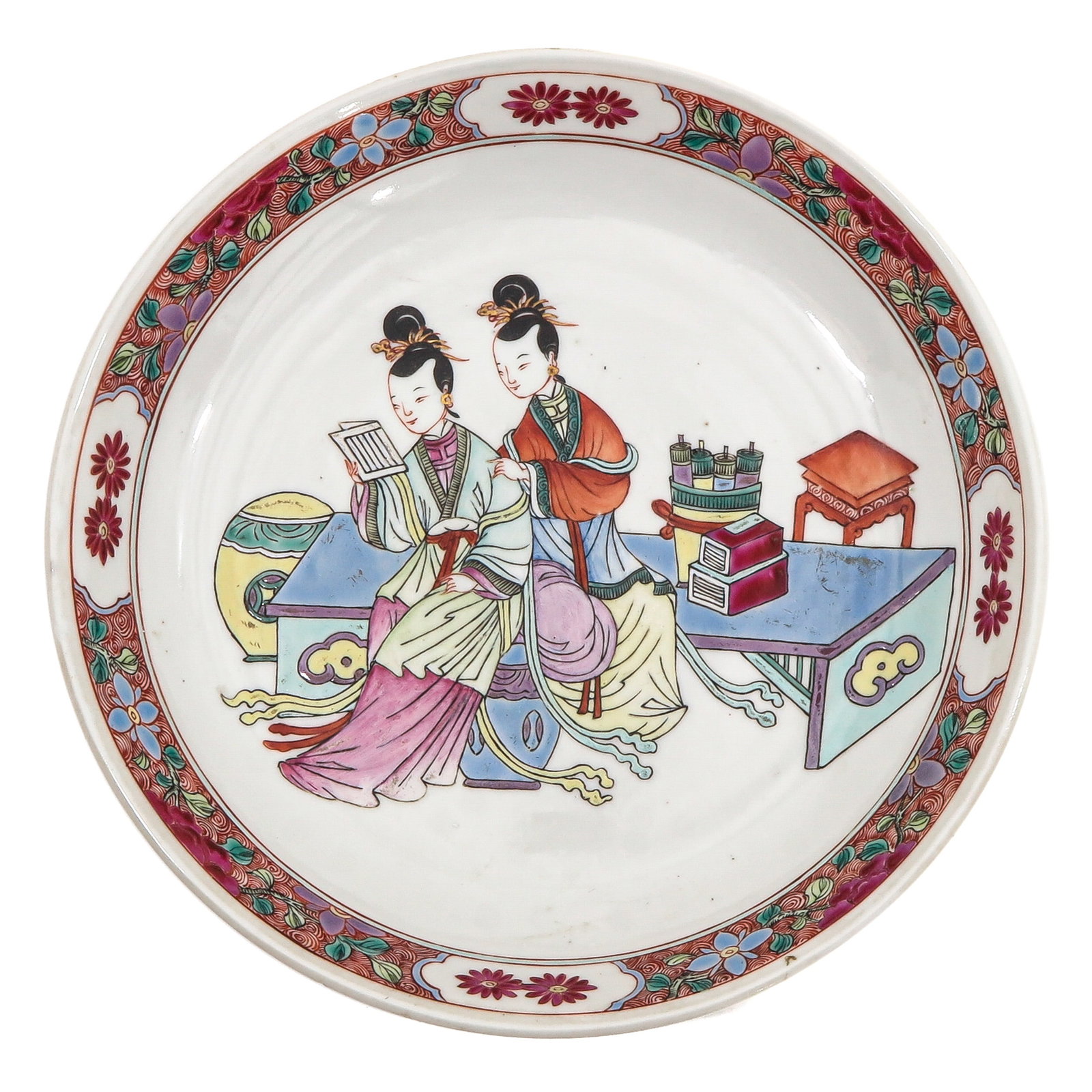 A Famille Rose Plate: Depicting Chinese ladies, 25 cm. in diameter, chip.