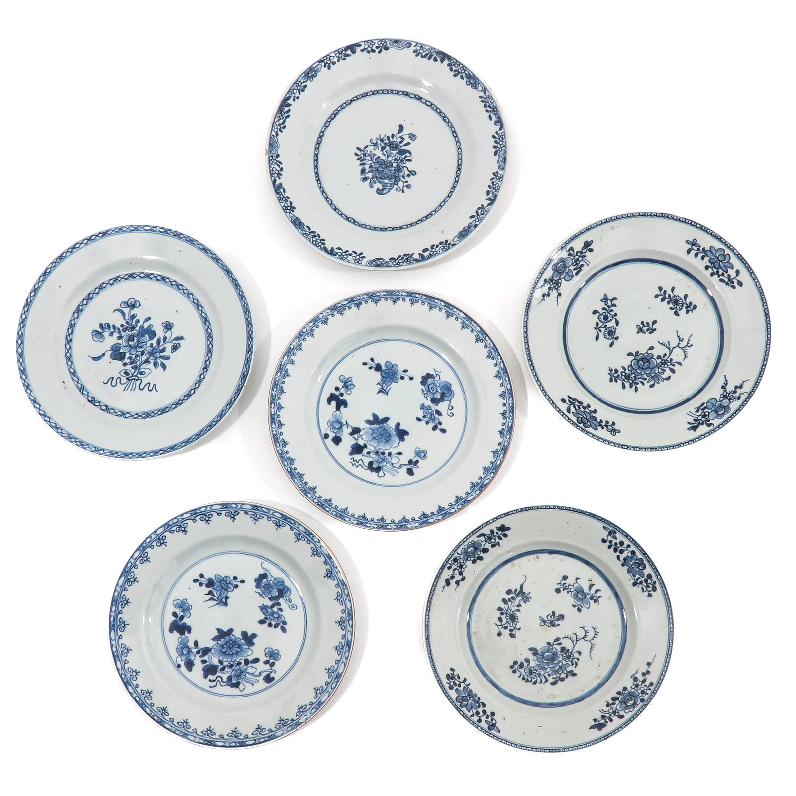 A Series of 6 Blue and White Plates: Floral decor, 24 cm. in diameter, Qianlong Period, chip.