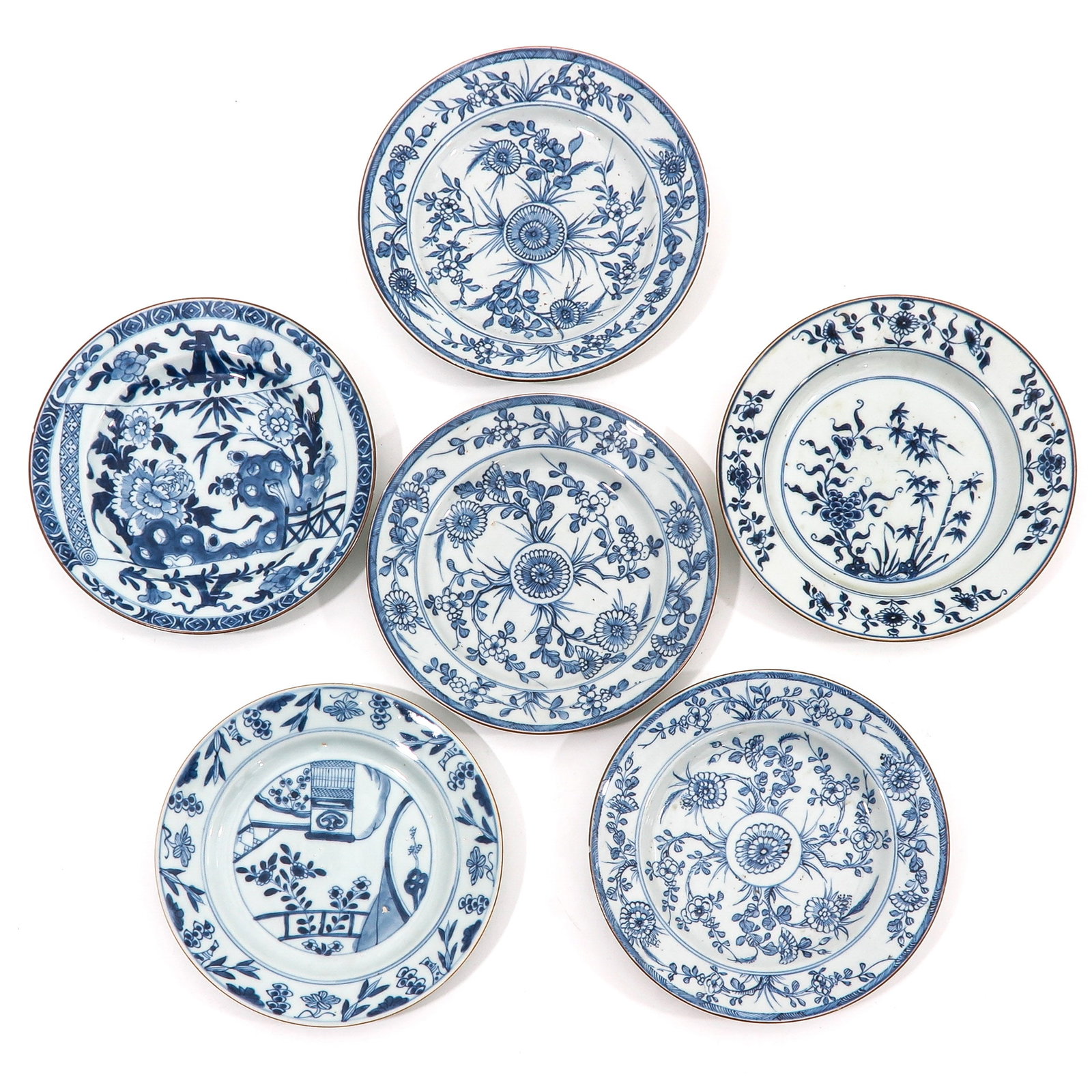 A Group of 6 Blue and White Plates: In a variety of decors, including 18th Century, 23 cm. in diameter, chip and hairline.
