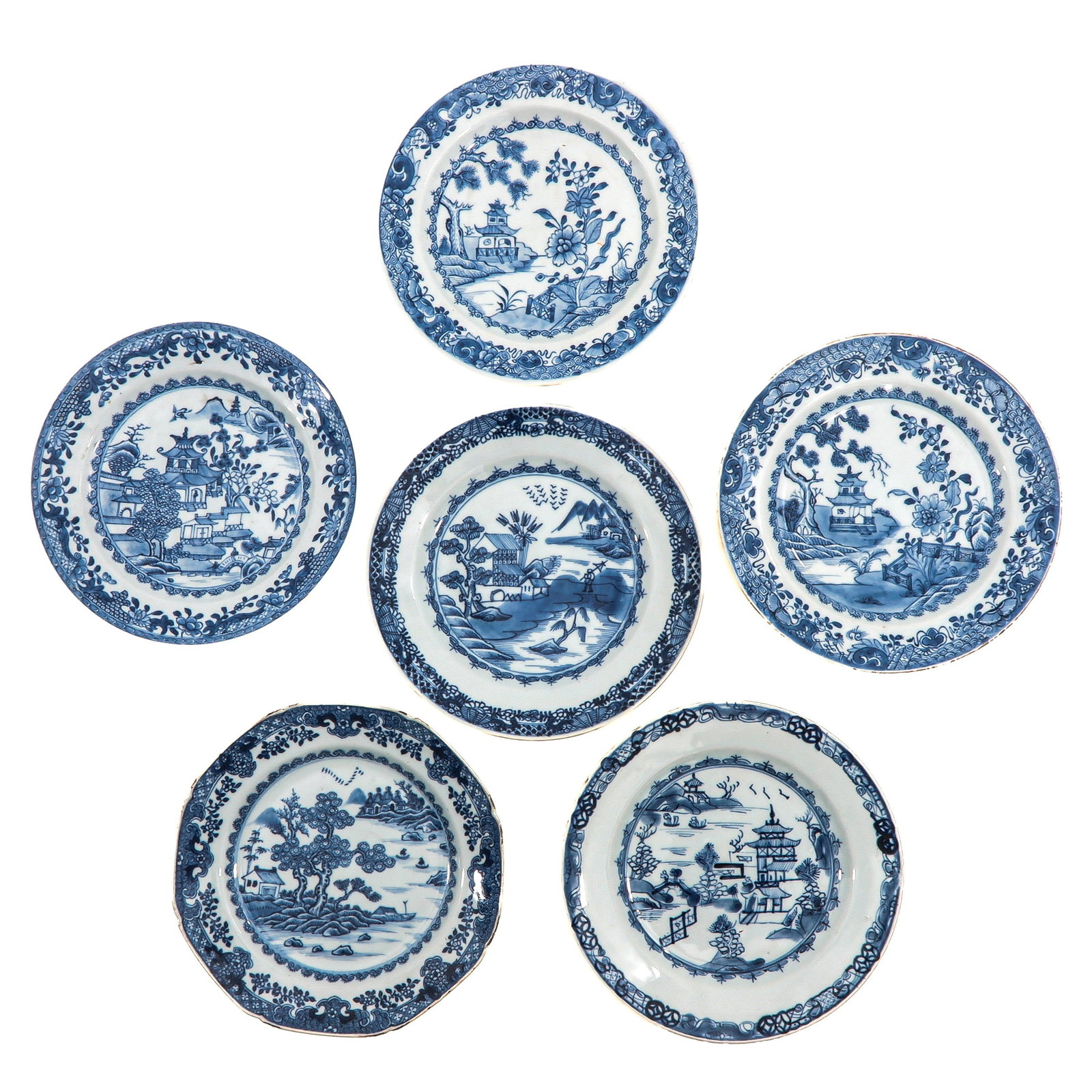 A Group of 6 Blue and White Plates: In a variety of decors, 18th Century, 23 cm. in diameter, chip and hairline.