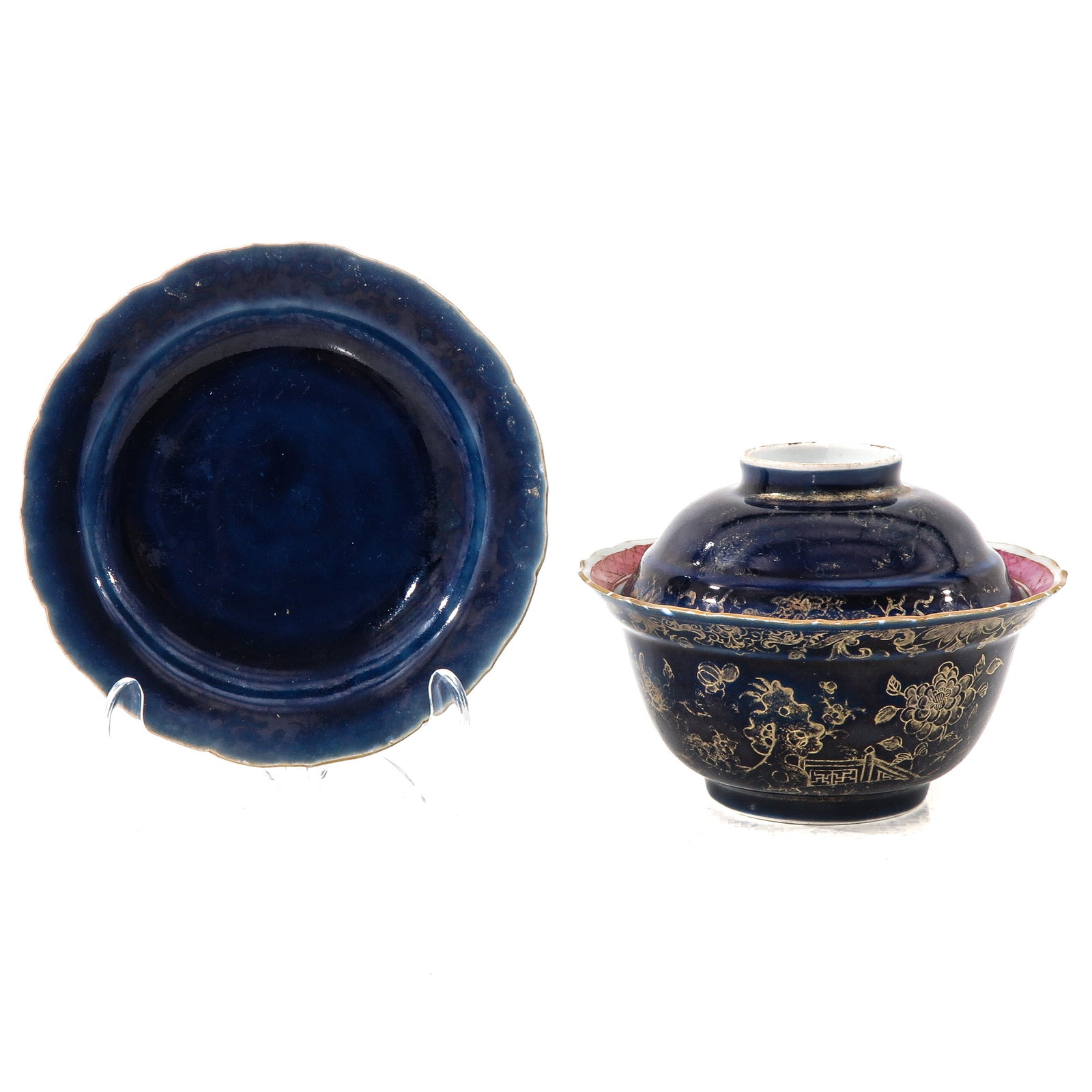 A Covered Bowl with Underplate: Dark blue ground decorated with gilt enamels, underplate is 15 cm. in diameter.