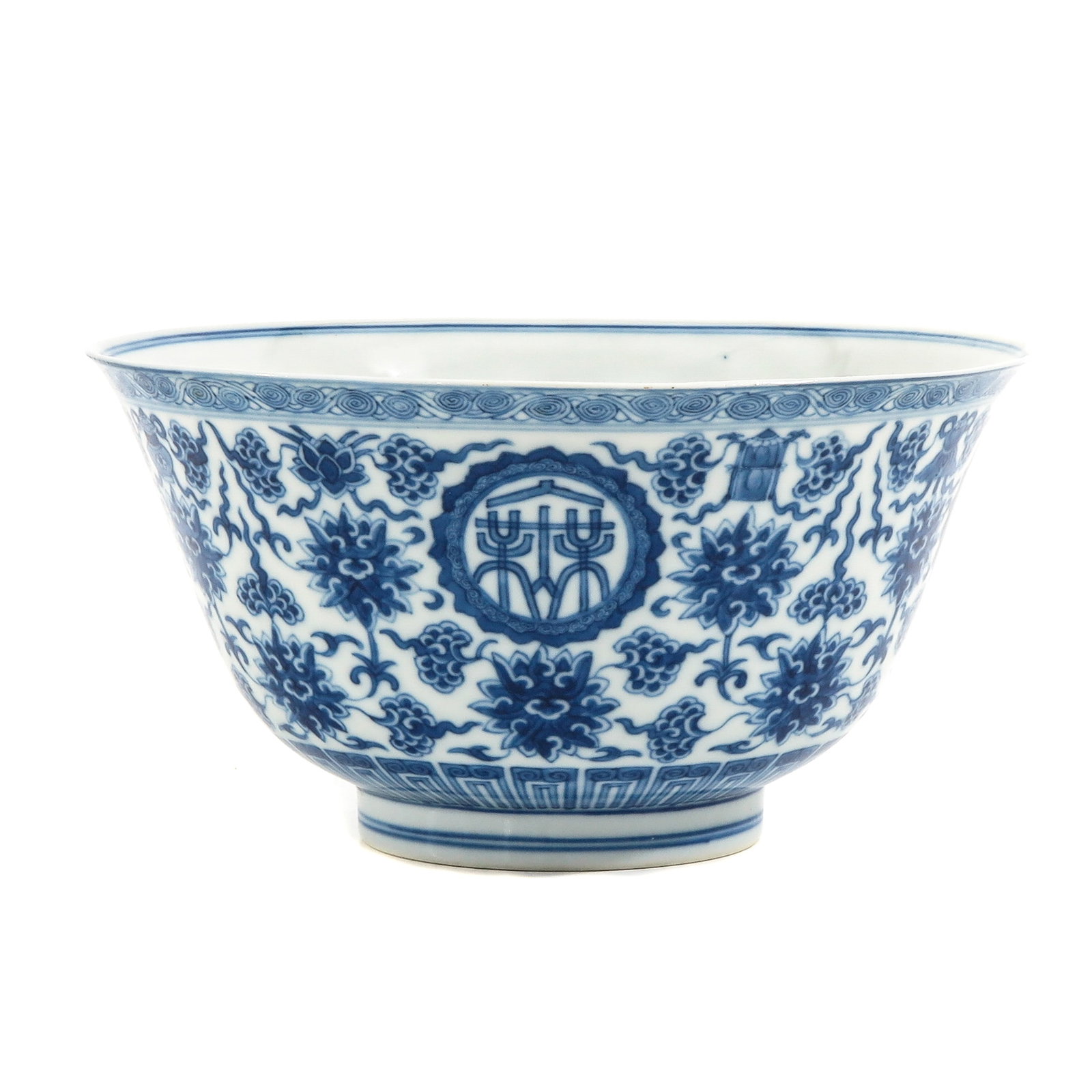 A Blue and White Bowl: Scrolling flowering decor with cartouches of Chinese symbols, Qianlong mark, 18 cm. in diameter.