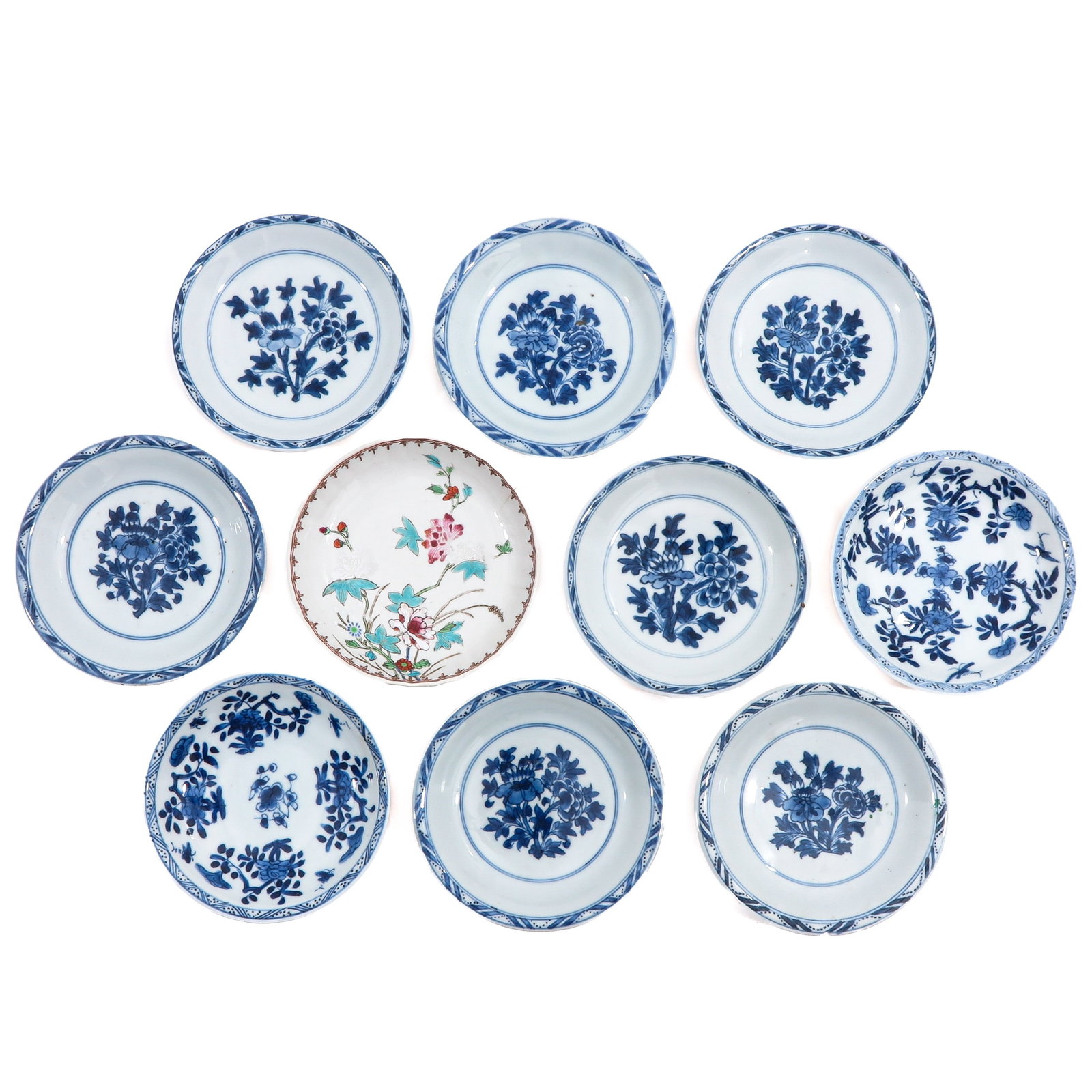 A Group of 10 Small Plates: In a variety of decors, 18th Century, 13 cm. in diameter, chip and hairline.