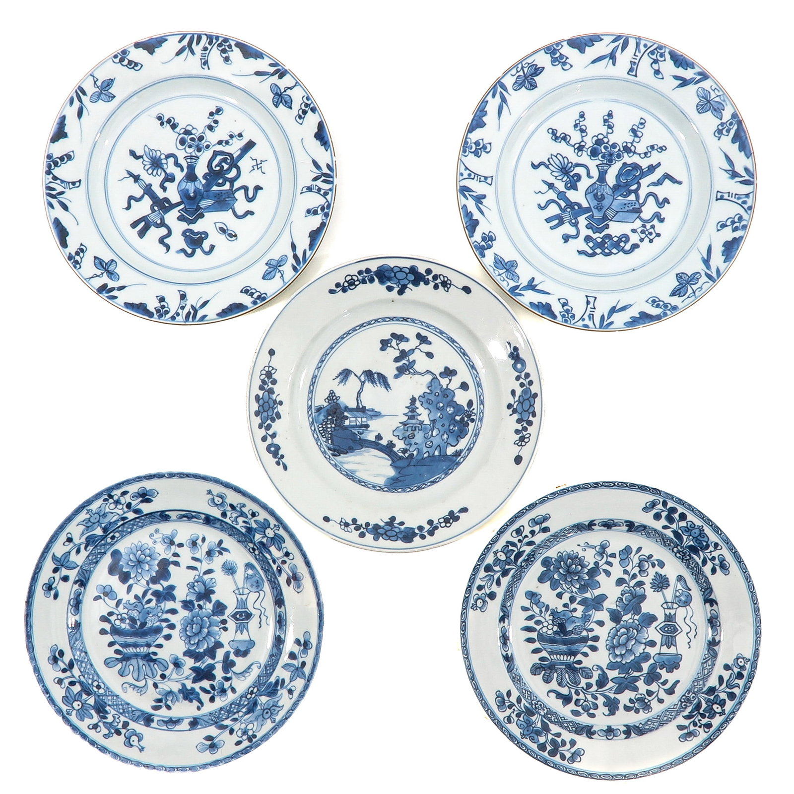 A Group of 5 Blue and White Plates: In a variety of decors, 18th Century, 23 cm. in diameter, chip and hairline.