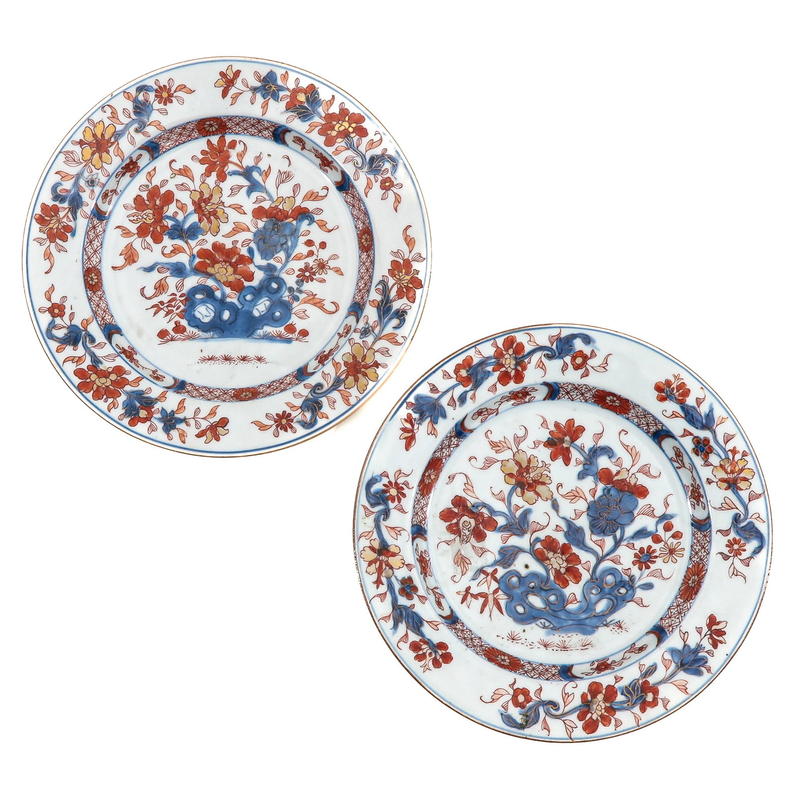 A Pair of Imari Plates: Depicting scene in a garden with flowers and rocks, 18th Century, 23 cm. in diameter.