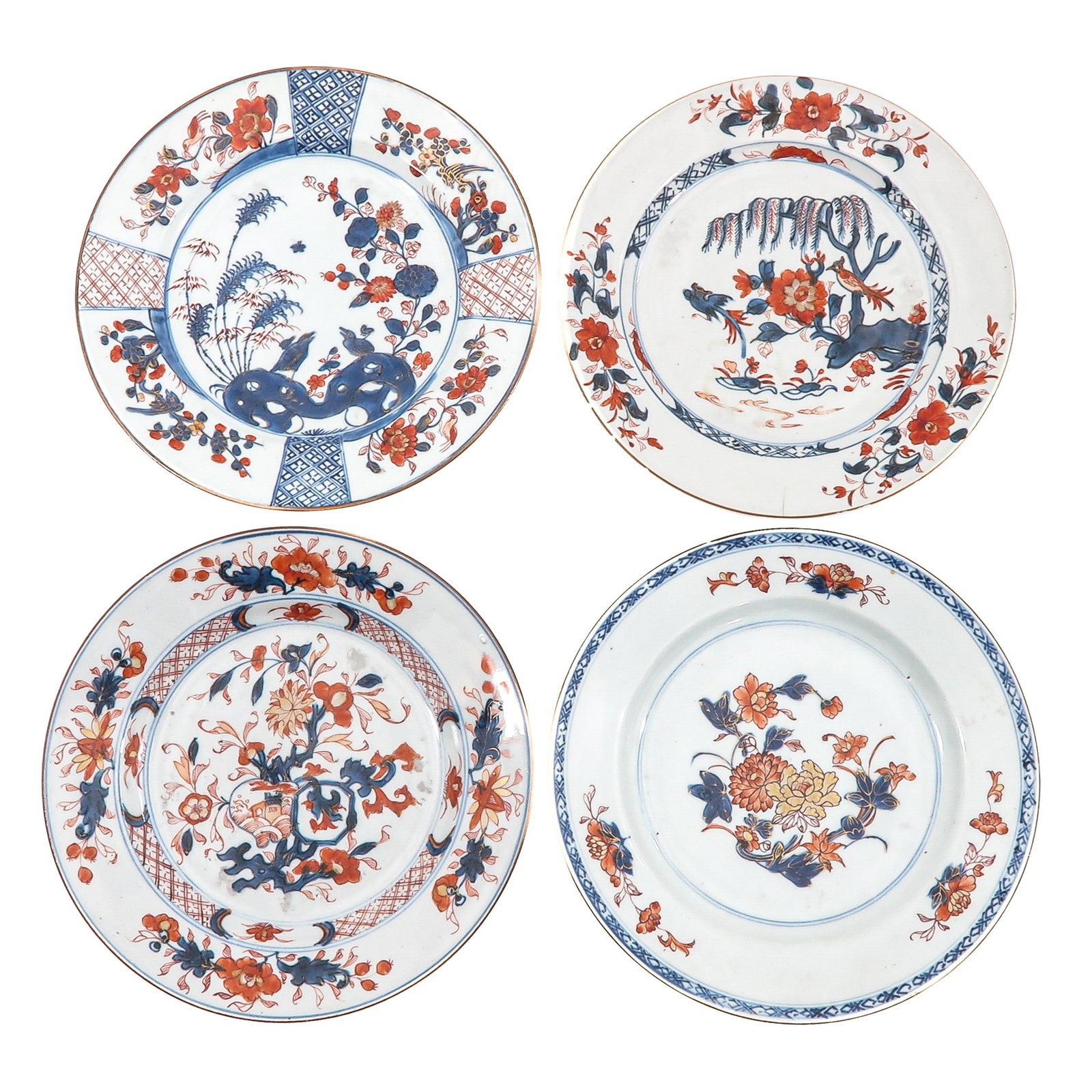 A Group of 4 Imari Plates: In a variety of decors, 18th Century, 23 cm. in diameter, chip and hairline.