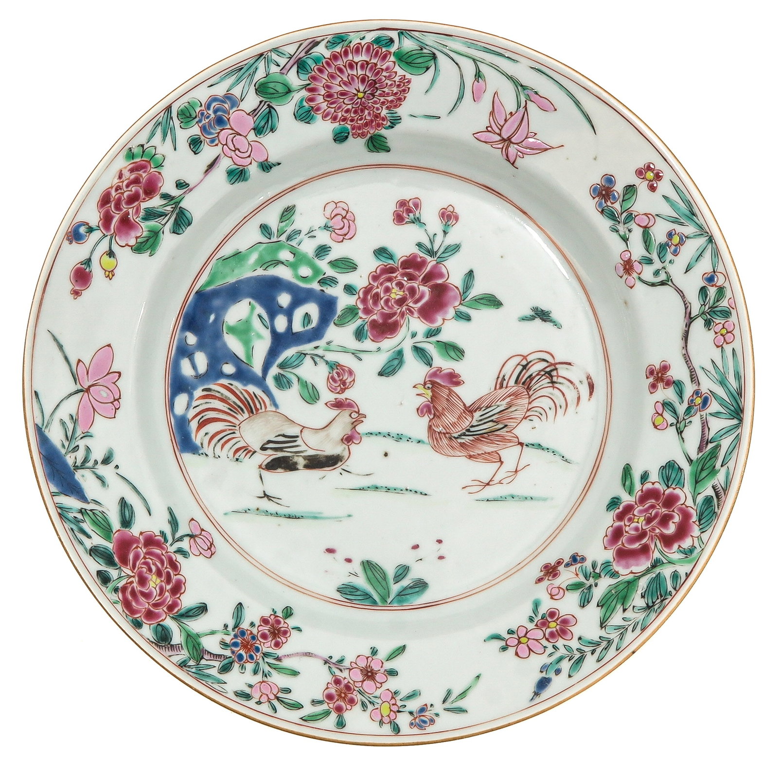 A Famille Rose Plate: Depicting roosters in a garden, 23 cm. in diameter.