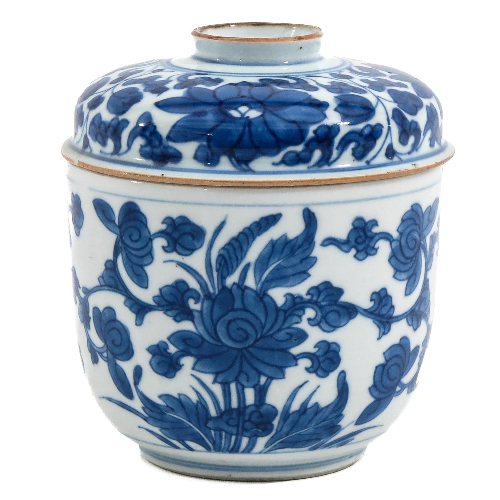A Blue and White Jar with Cover: Scrolling floral decor, 18th Century, 13 cm. tall.