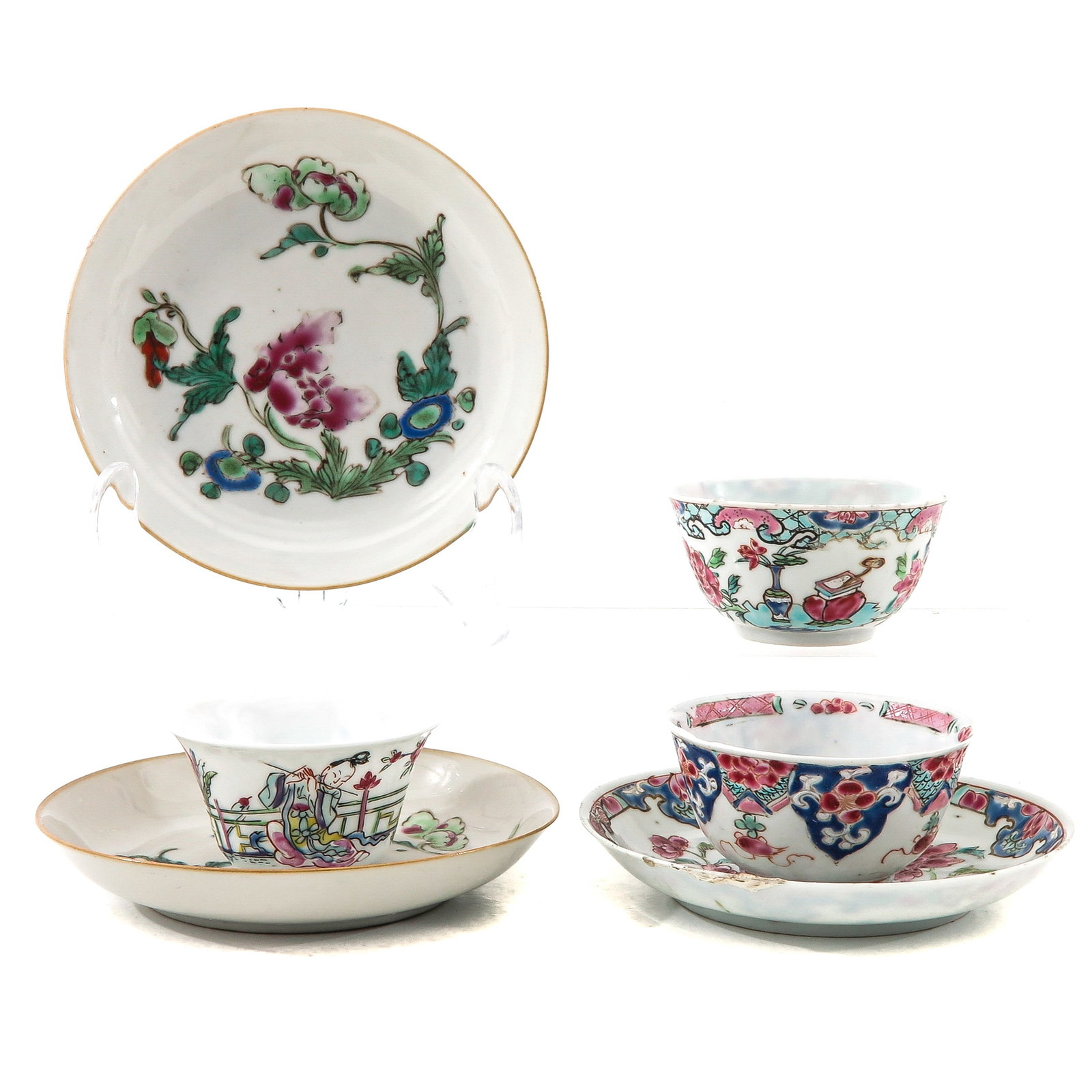 A Group of Cups and Saucers: Including 3 cups and 3 saucers in a variety of Famille Rose enamels, including 18th Century, largest saucer is 12 cm. in diameter, chip and hairline.