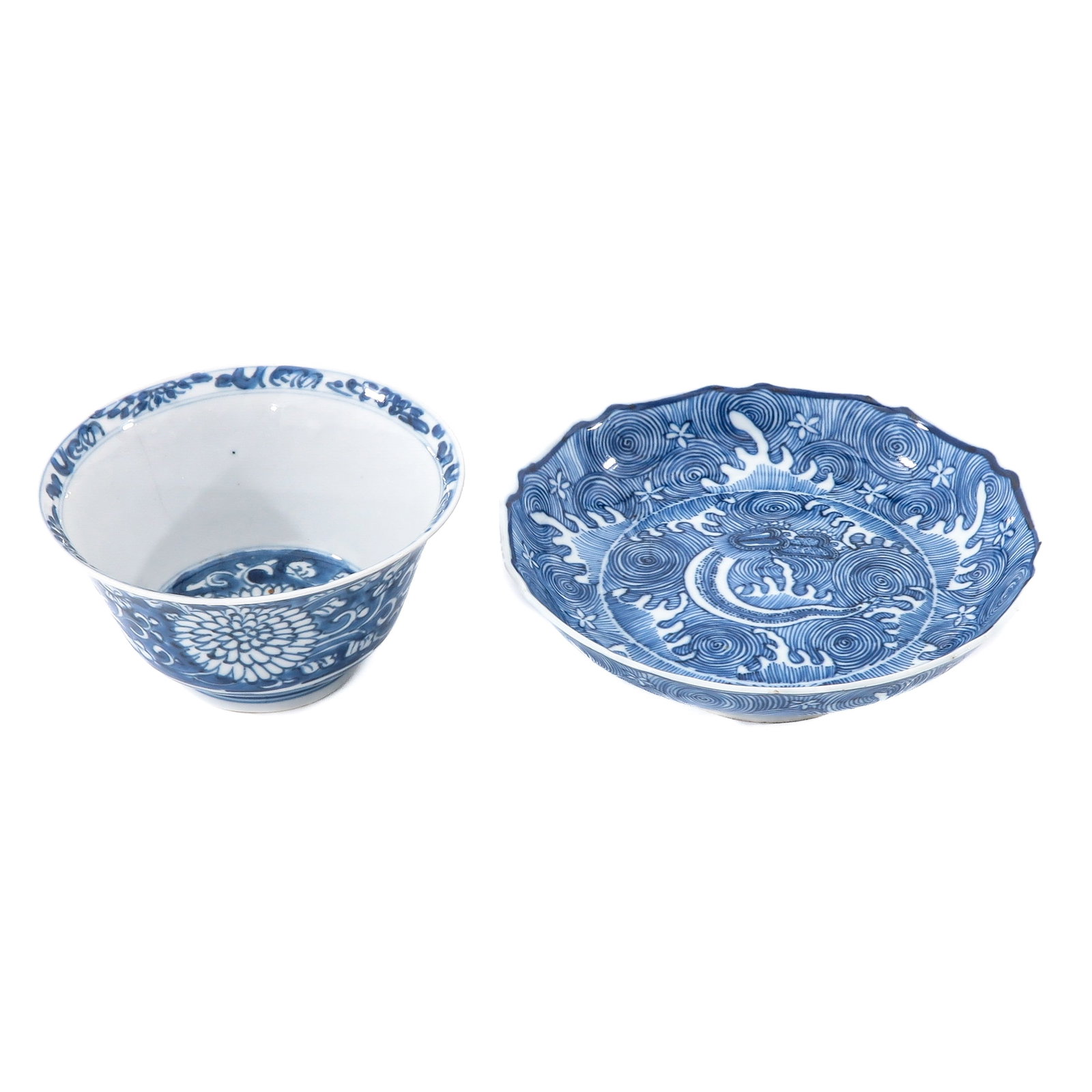 A Bowl and Stemmed Dish: Bowl is decorated with a dark blue ground with flowers, stemmed dish depicting a dragon and measures 18 cm. in diameter.