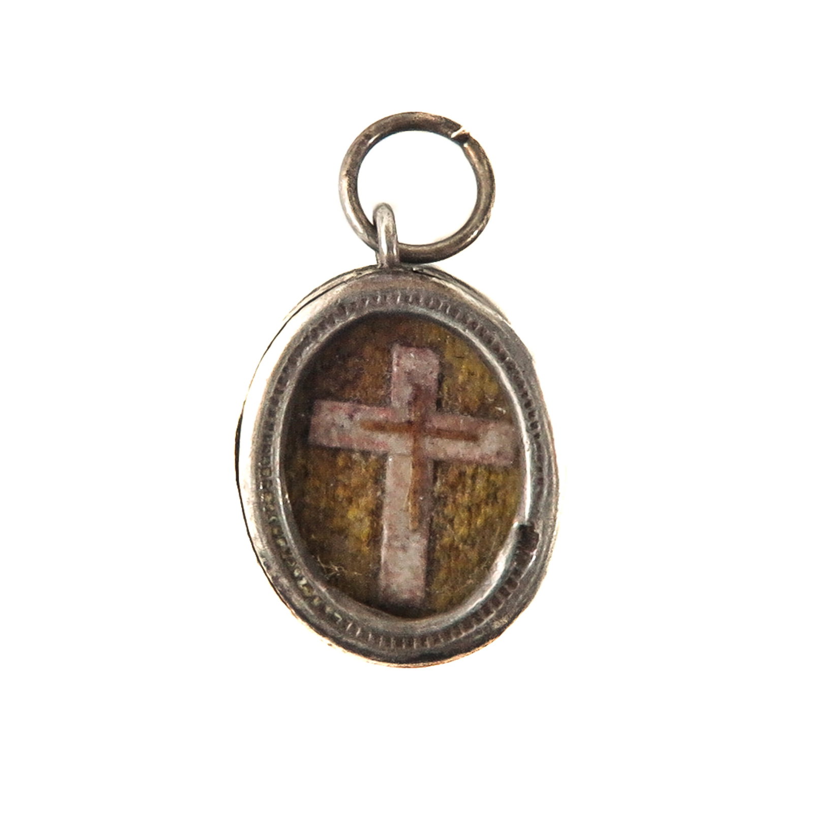 A Sealed Reliquary: Silver, containing a relic of the Holy Cross, length 2.5 cm. You are buying the theca; the Relics are a gift.