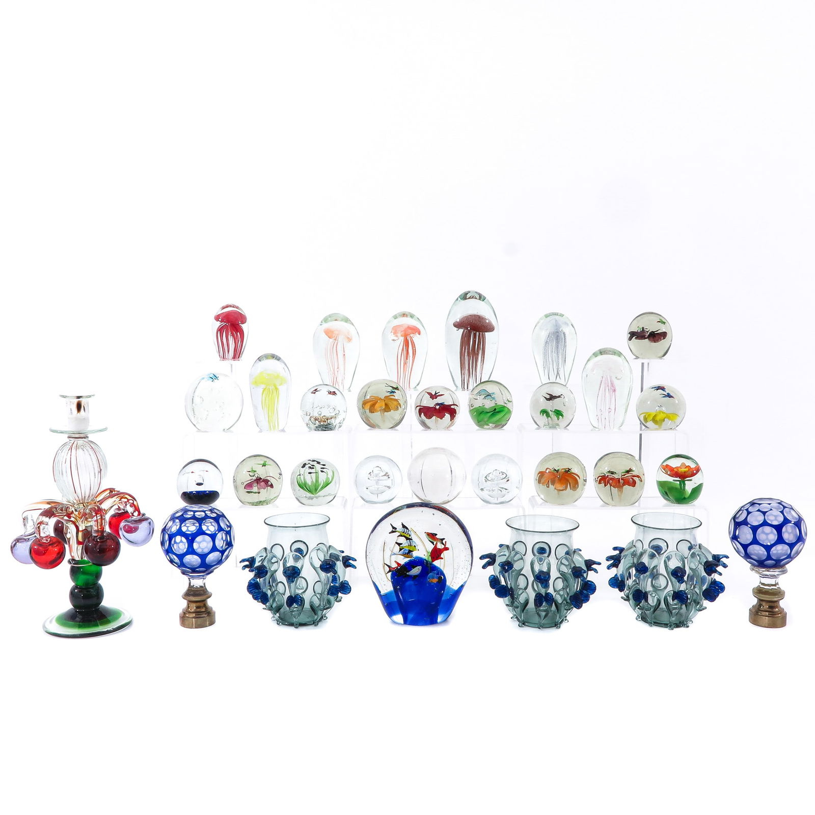 A Lot of Decorative Glassware: Consisting of decorative glass paperweights, vases, and candlestick, height 33 cm.